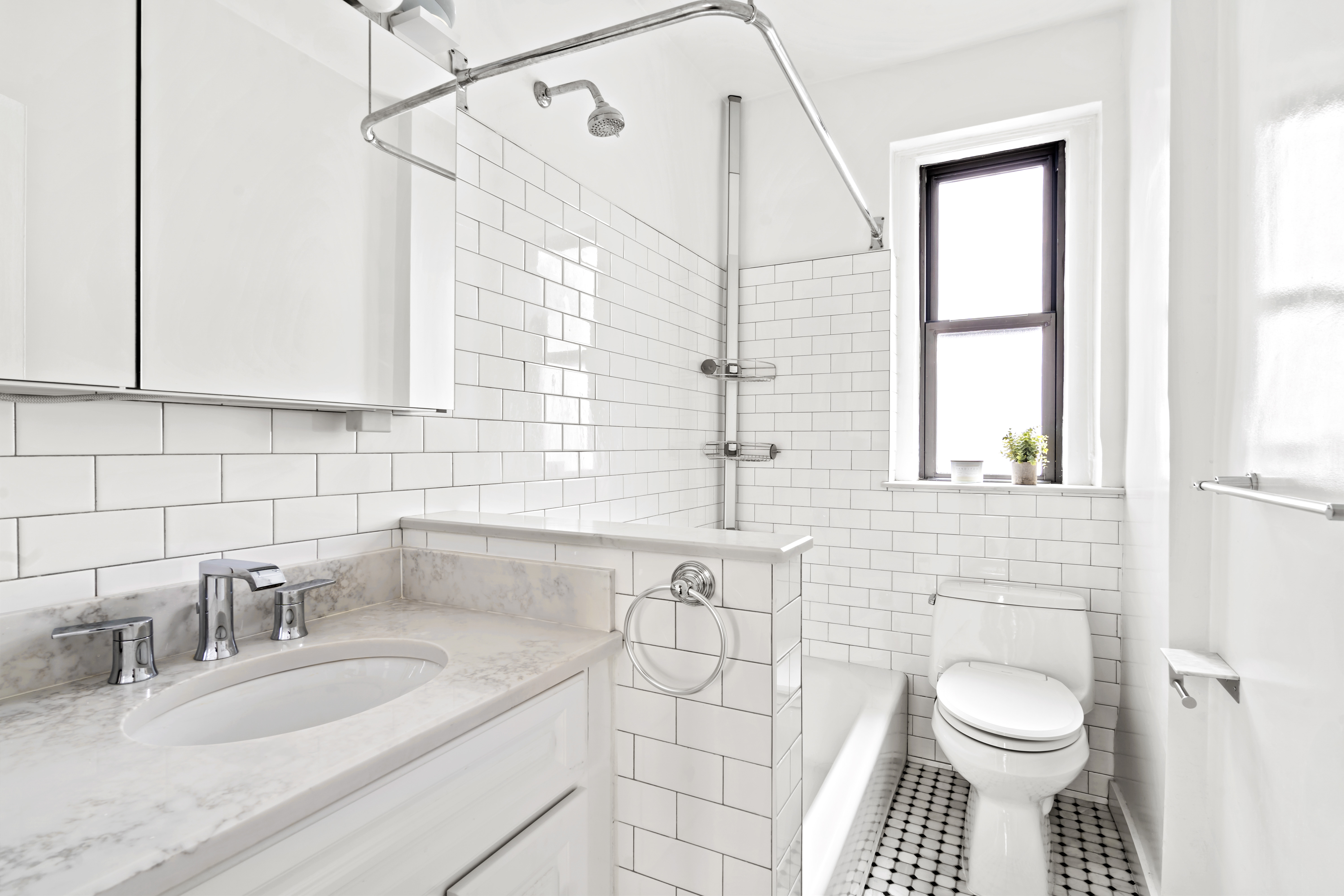 225 West 25th Street, Unit 5D Manhattan, NY 10001 - Photo 6 of 16 a bathroom with a granite countertop sink toilet and shower