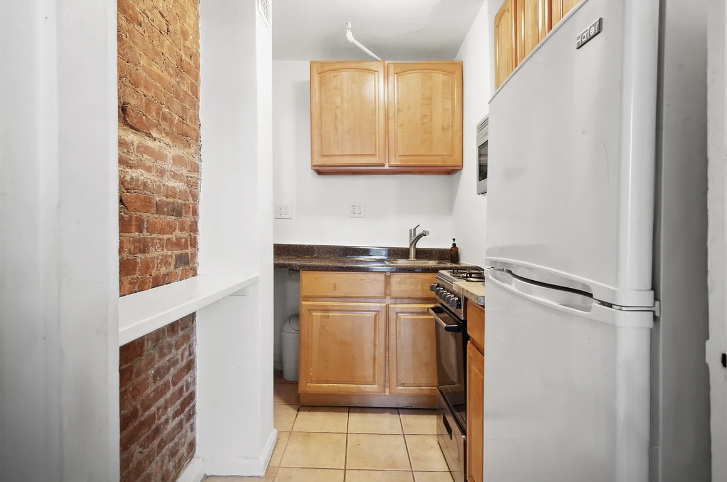 397 Clermont Avenue, Unit 3R Brooklyn, NY 11238 - Photo 4 of 8 a bathroom with a sink and a mirror