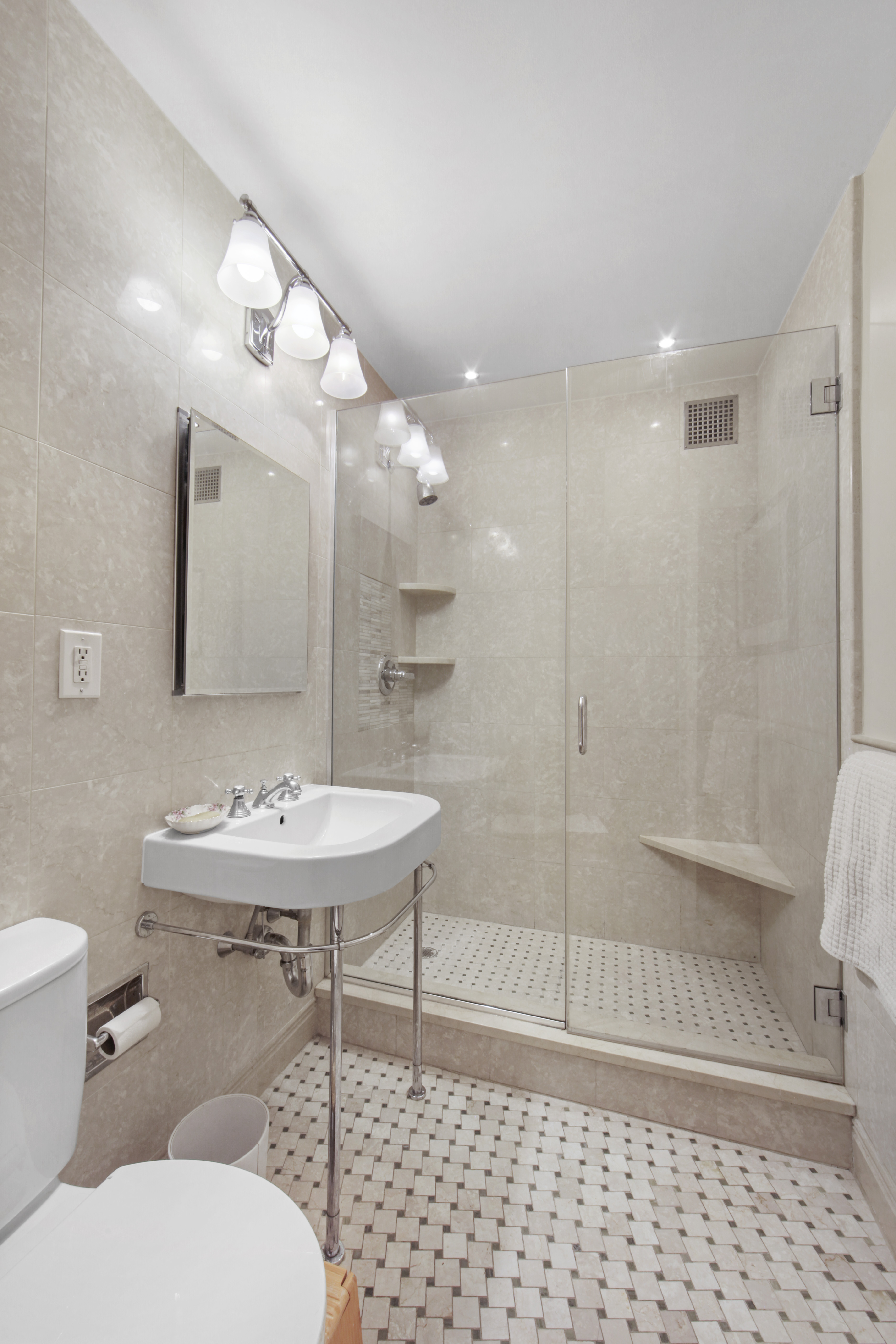 18 East 12th Street, Unit 7BC Manhattan, NY 10003 - Photo 22 of 26 a bathroom with a sink toilet and shower