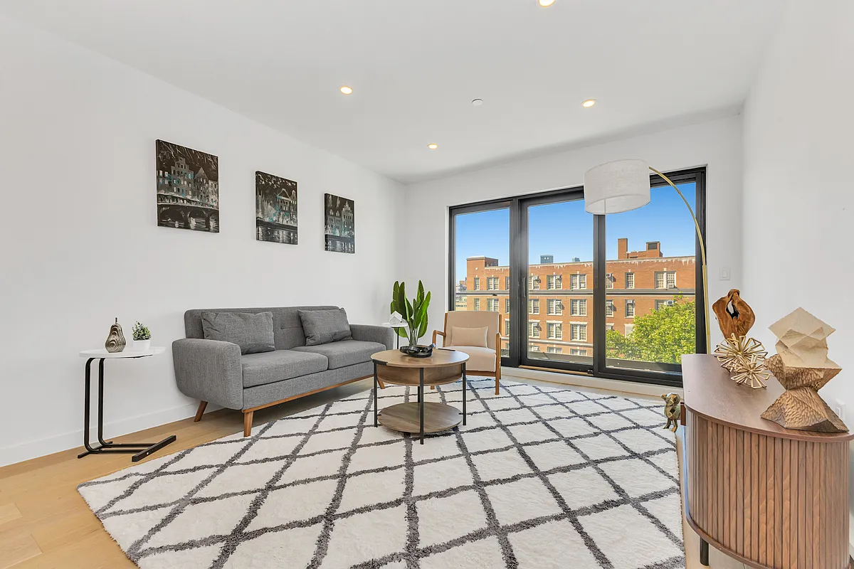 21-10 31st Avenue, Unit 6R Queens, NY 11106 - Photo 1 of 17 a living room with furniture