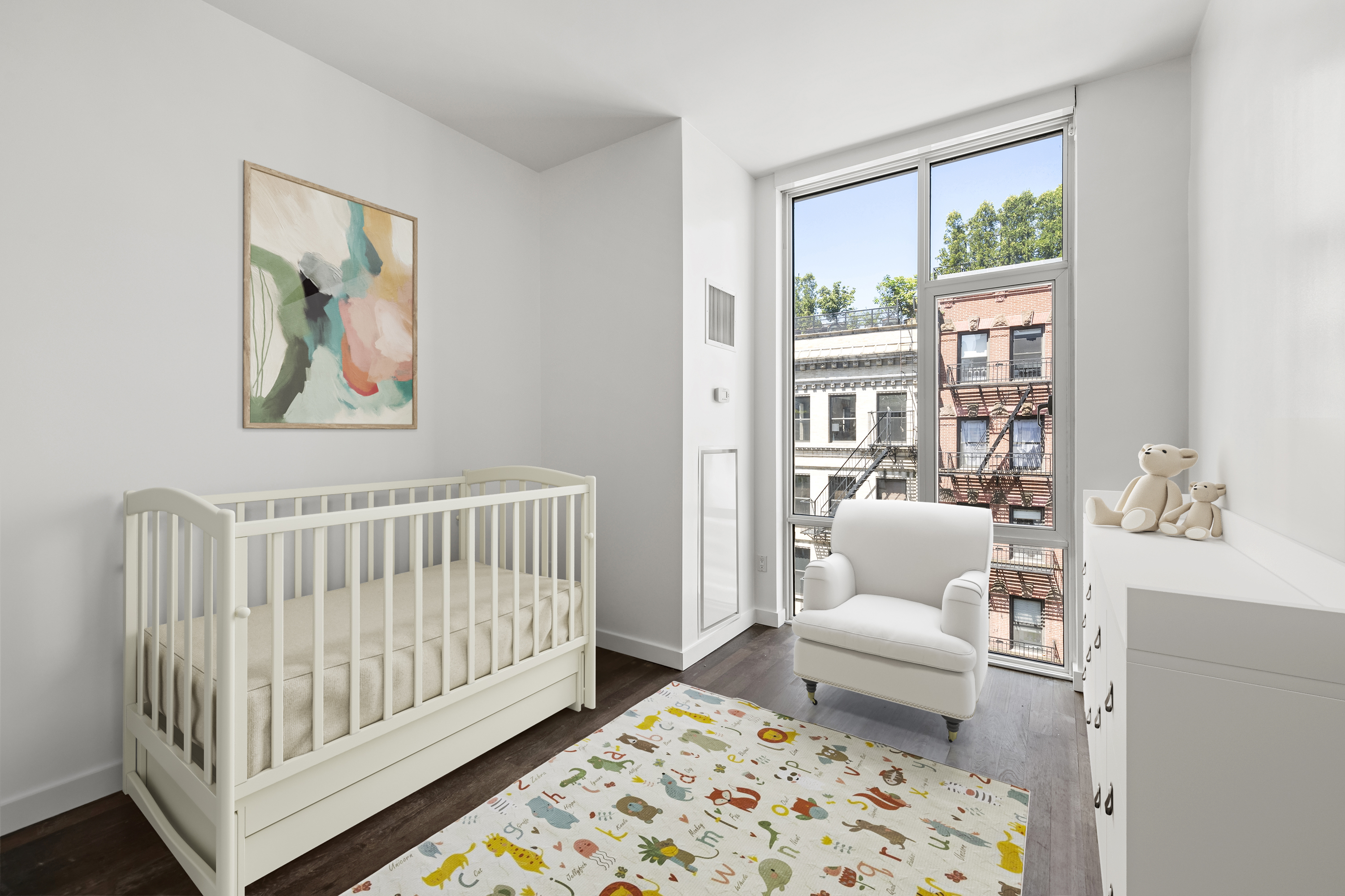 475 Greenwich Street, Unit PHN Manhattan, NY 10013 - Photo 17 of 28 a living room with furniture and a baby crib