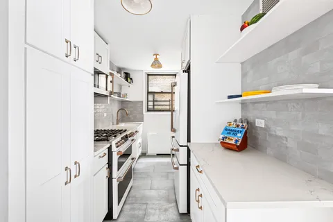 a bedroom with a large bed and a large window