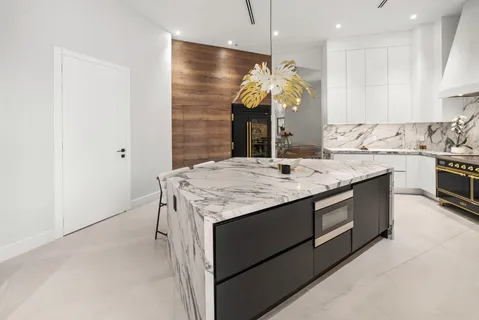 a kitchen with a sink and a refrigerator