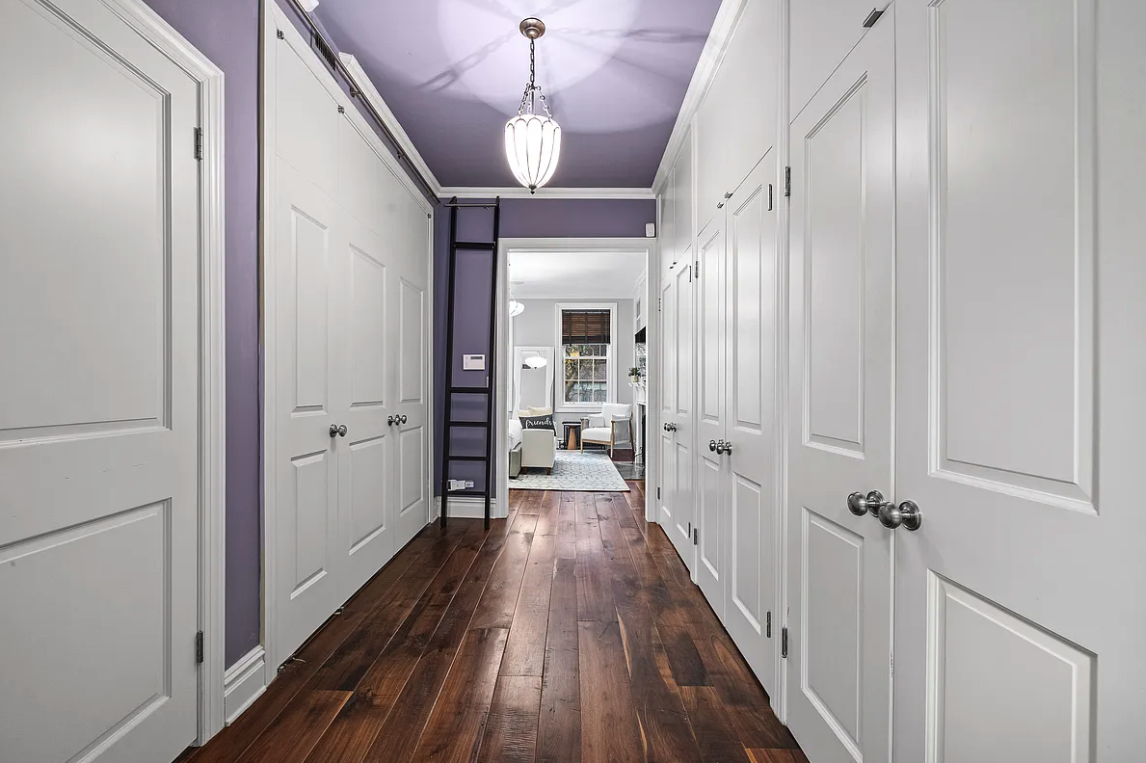 58 Downing Street Manhattan, NY 10014 - Photo 11 of 21 a view of a hallway with wooden floor and staircase