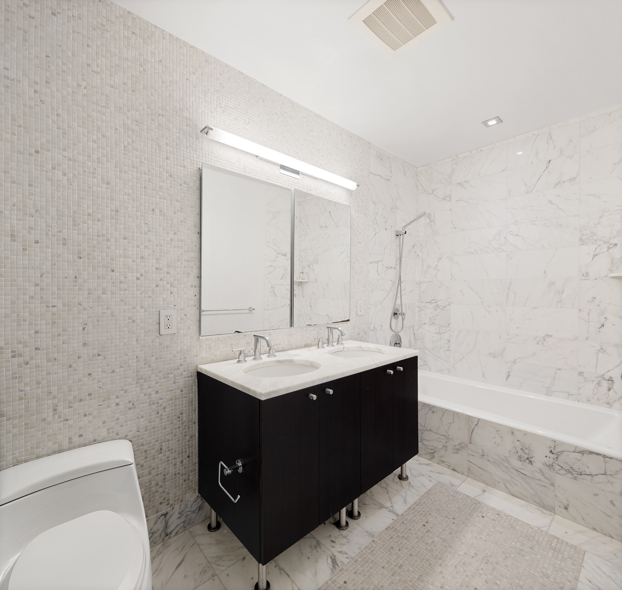 46-30 Center Boulevard, Unit PH8 Queens, NY 11109 - Photo 13 of 32 a bathroom with a sink toilet and vanity