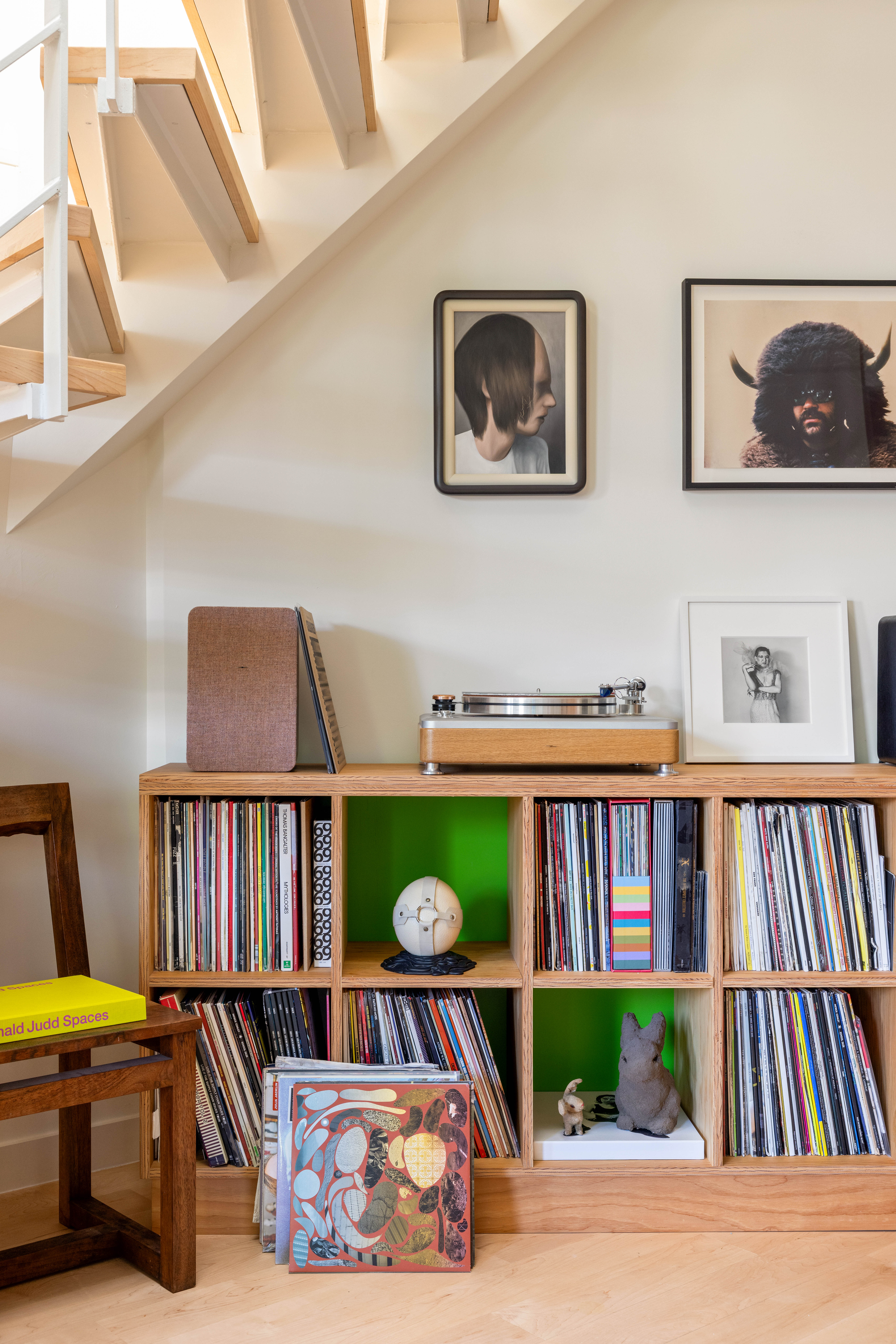 130 Jane Street, Unit 5/6F Manhattan, NY 10014 - Photo 10 of 23 a living room with lots of furniture and a book shelf