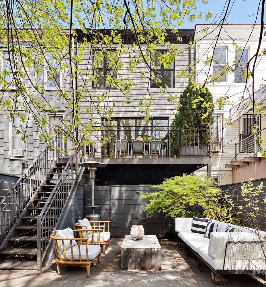 a view of a chairs and table in the patio