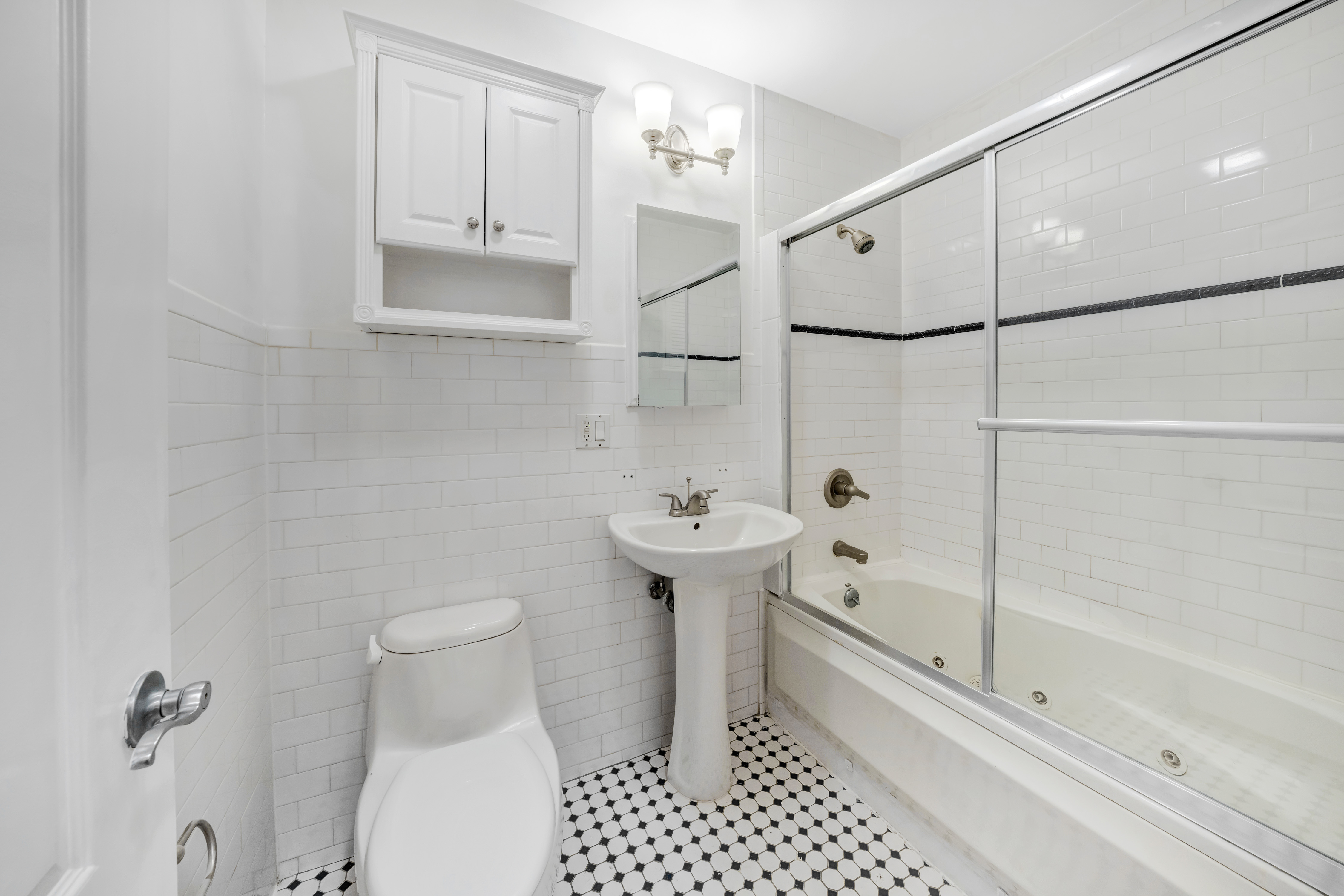 330 Bergen Street, Unit 1/C Brooklyn, NY 11217 - Photo 8 of 11 a bathroom with a shower a toilet and sink