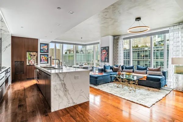 a living room with furniture and a large window