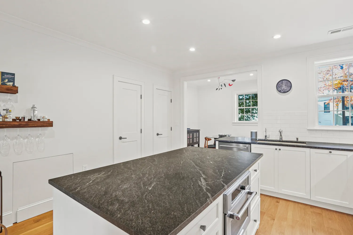 a kitchen with a sink a counter top space and cabinets