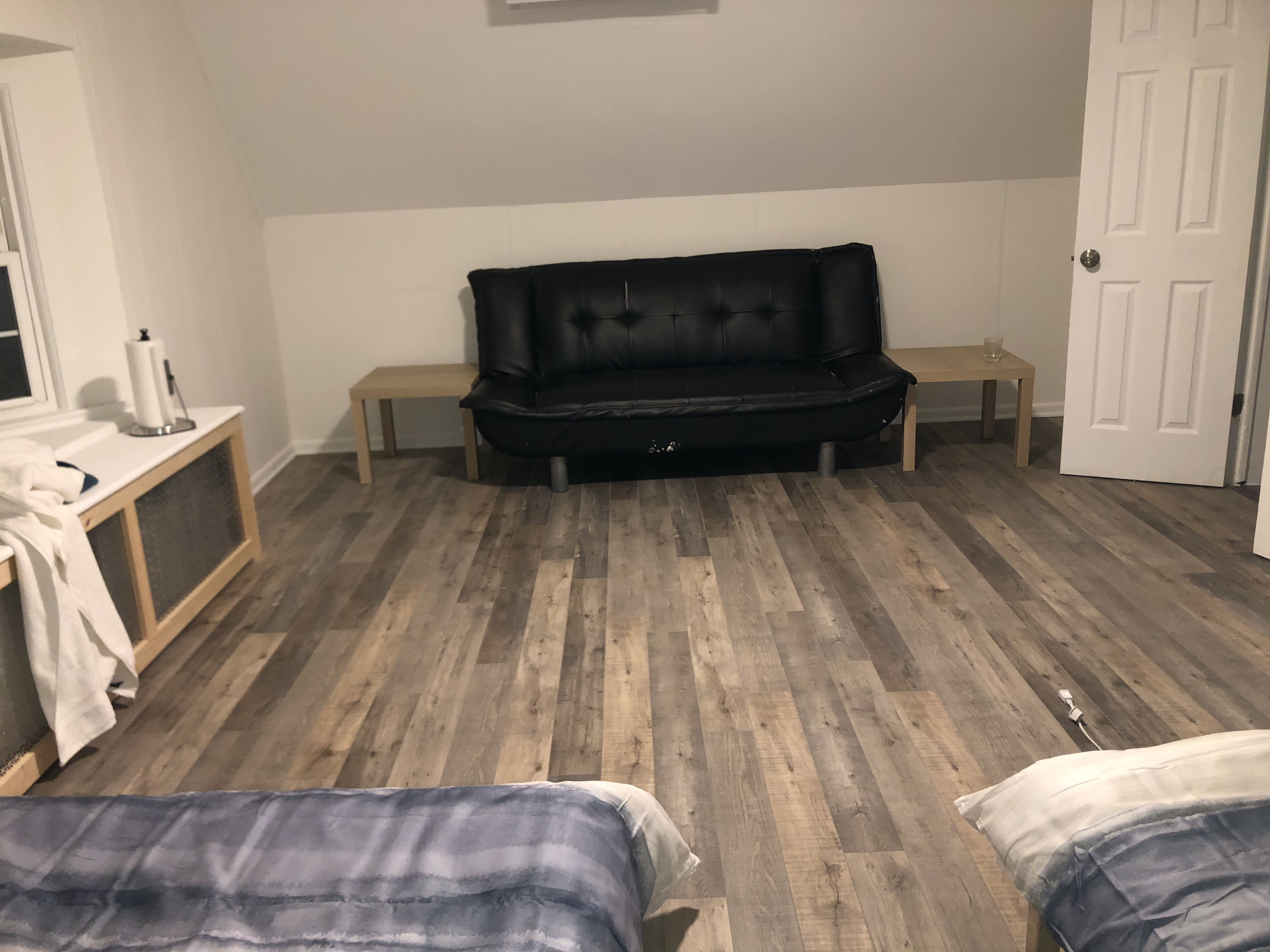 1112 Beverley Road Brooklyn, NY 11218 - Photo 8 of 53 a living room with a couch and a fireplace