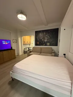 a bedroom with a bed and window