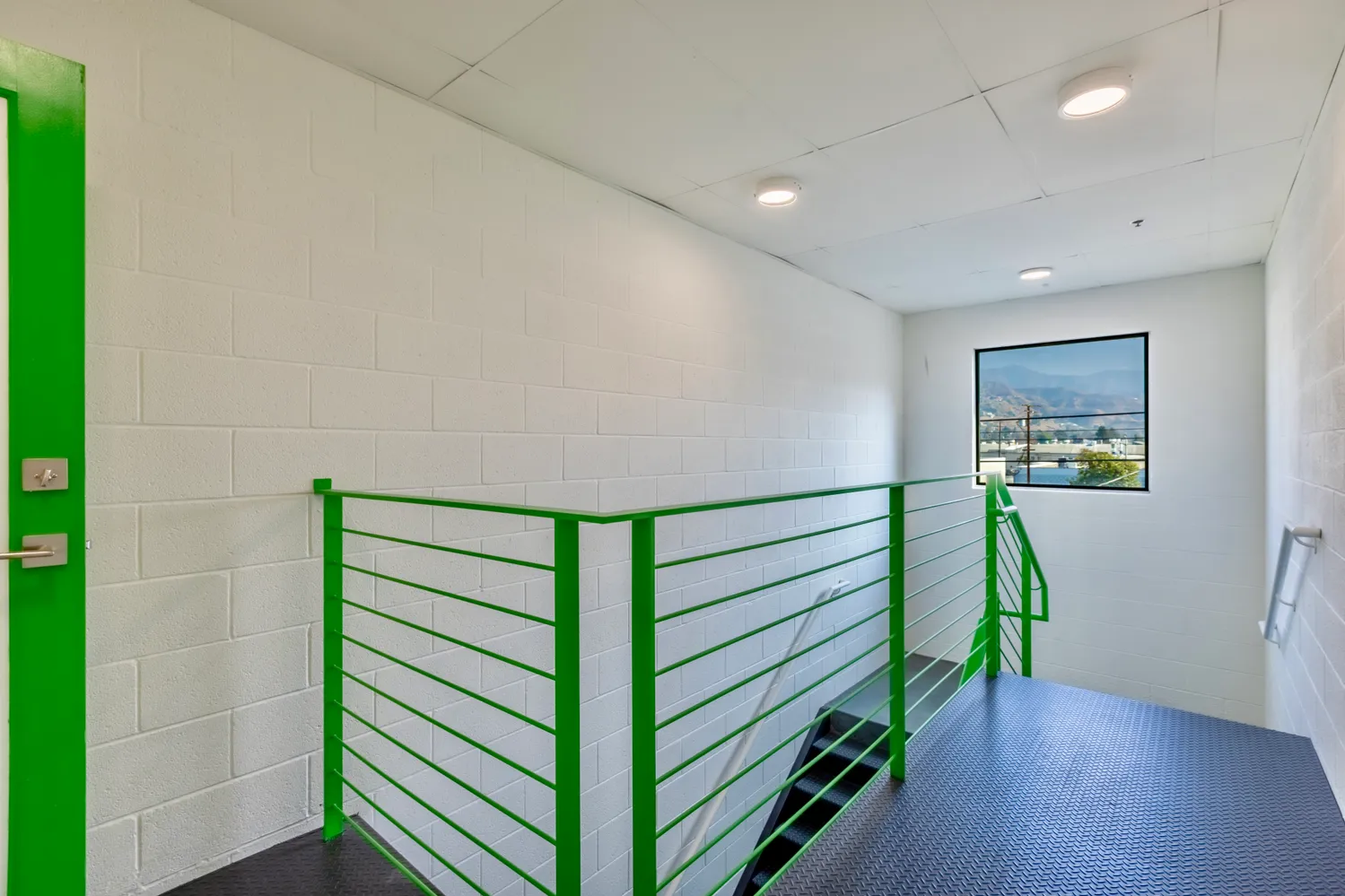 a view of a hallway with washer and dryer