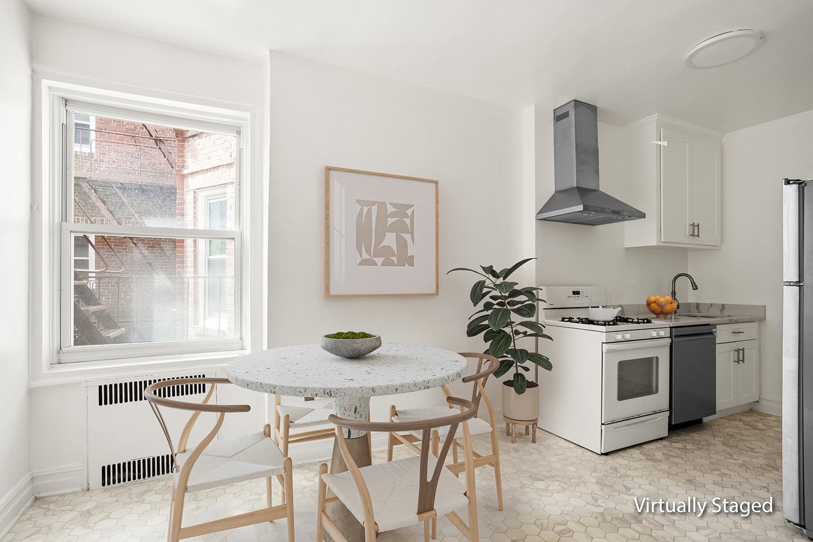 72-17 34th Avenue, Unit 4J Queens, NY 11372 - Photo 7 of 14 a kitchen with a stove a window cabinets and stainless steel appliances