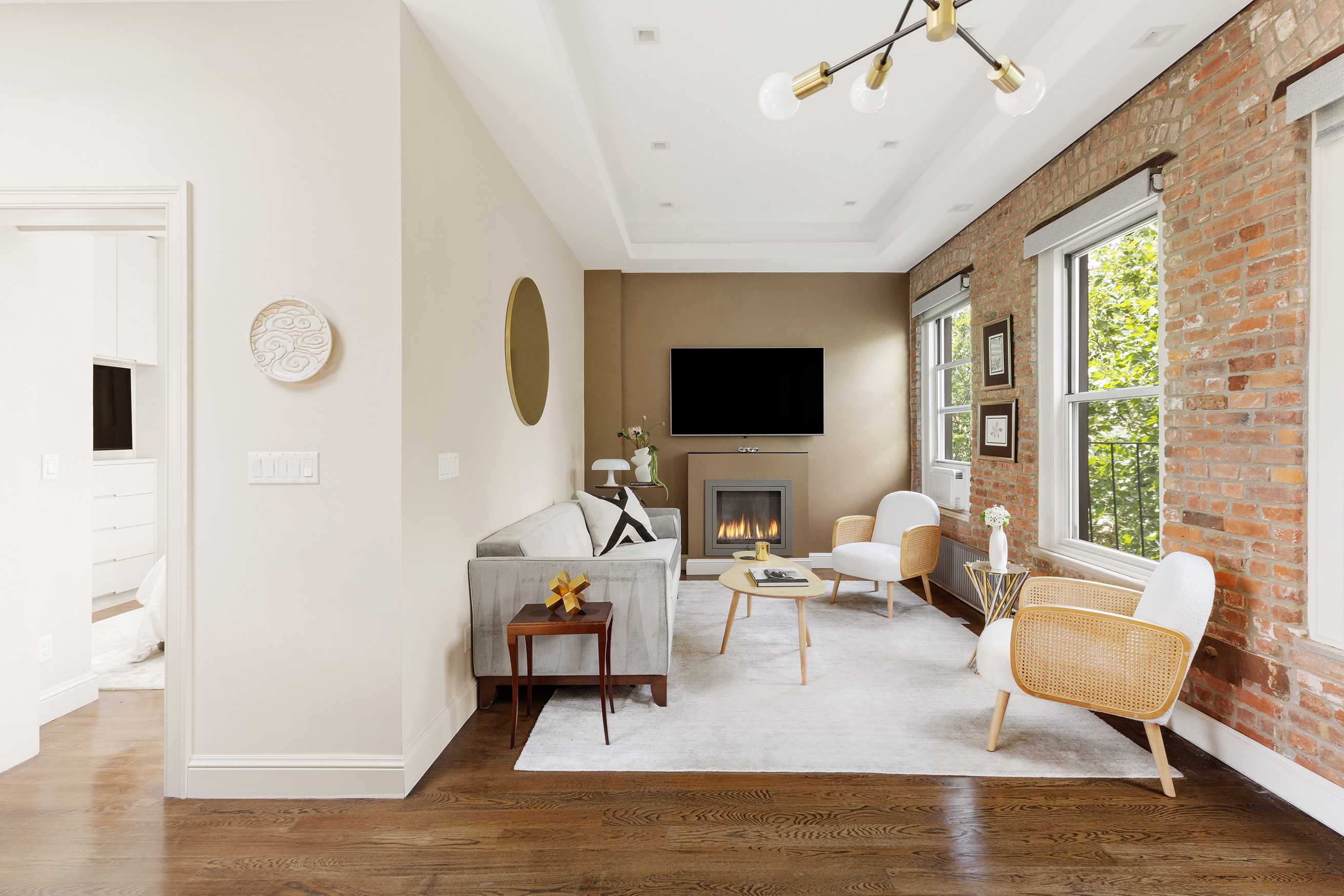 77 Perry Street, Unit 6CD Manhattan, NY 10014 - Photo 4 of 16 a living room with furniture and a flat screen tv