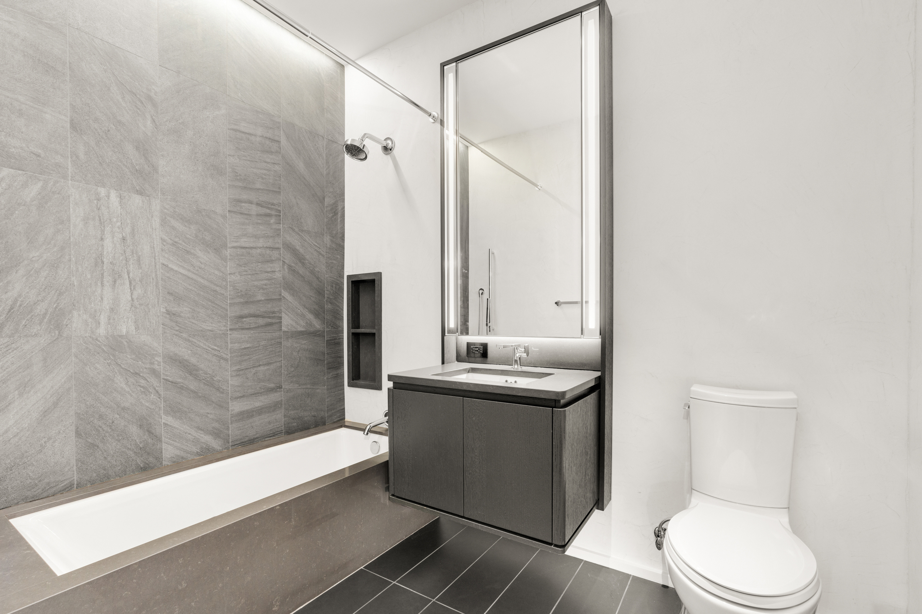 77 Charlton Street, Unit S10A Manhattan, NY 10014 - Photo 11 of 27 a bathroom with a granite countertop sink toilet and shower