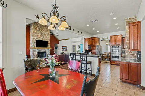 a kitchen with stainless steel appliances granite countertop a sink and cabinets
