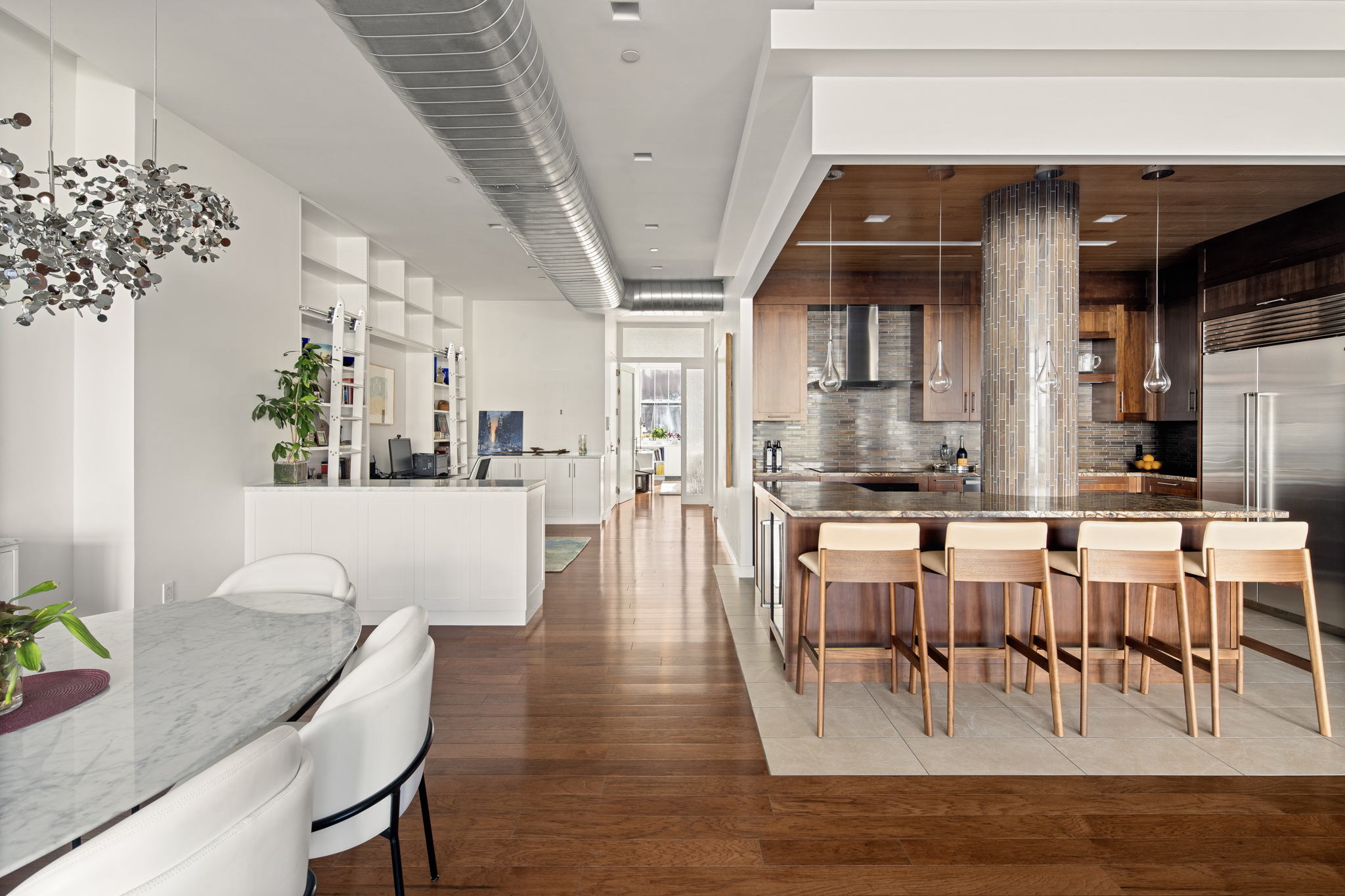 561 Broadway, Unit 10C Manhattan, NY 10012 - Photo 5 of 11 a view of a dining room with furniture window and wooden floor