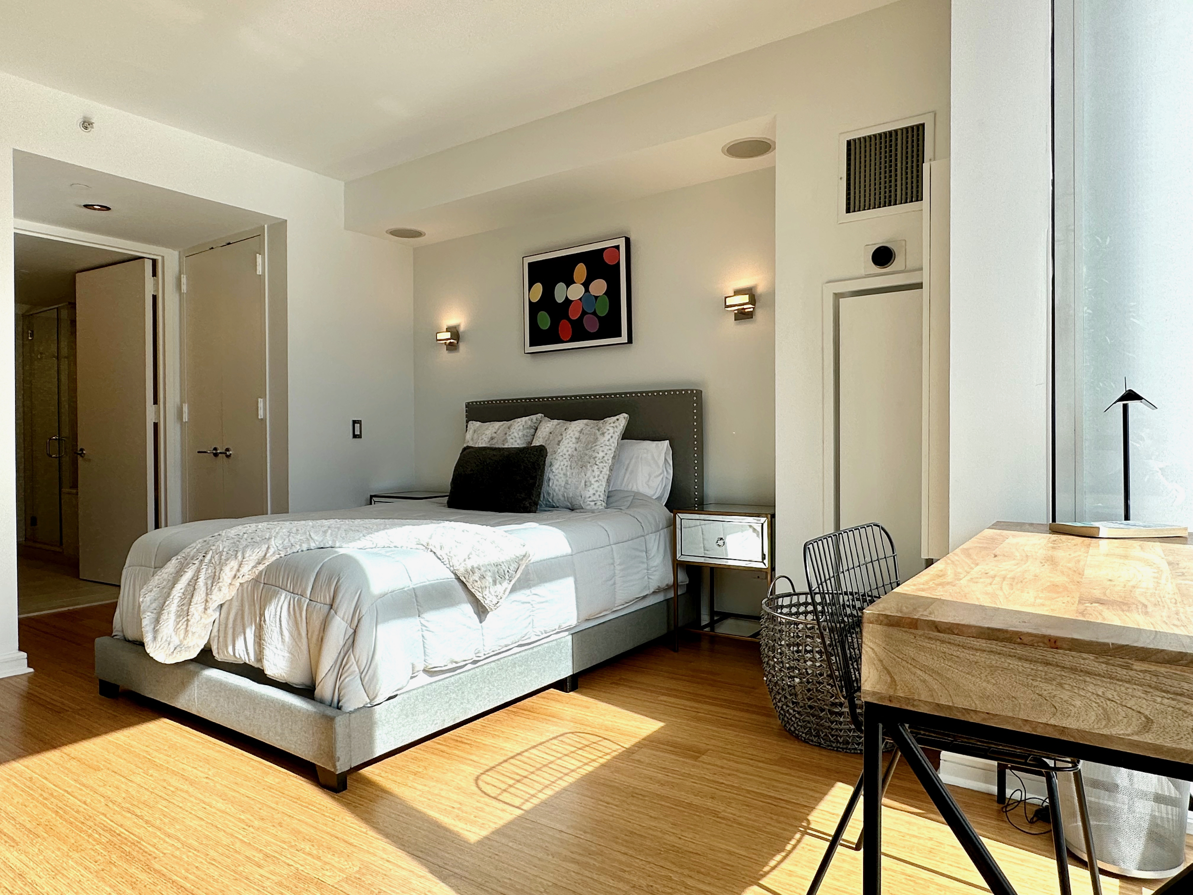 350 West 53rd Street, Unit PHA Manhattan, NY 10019 - Photo 14 of 35 a bedroom with a bed and a table