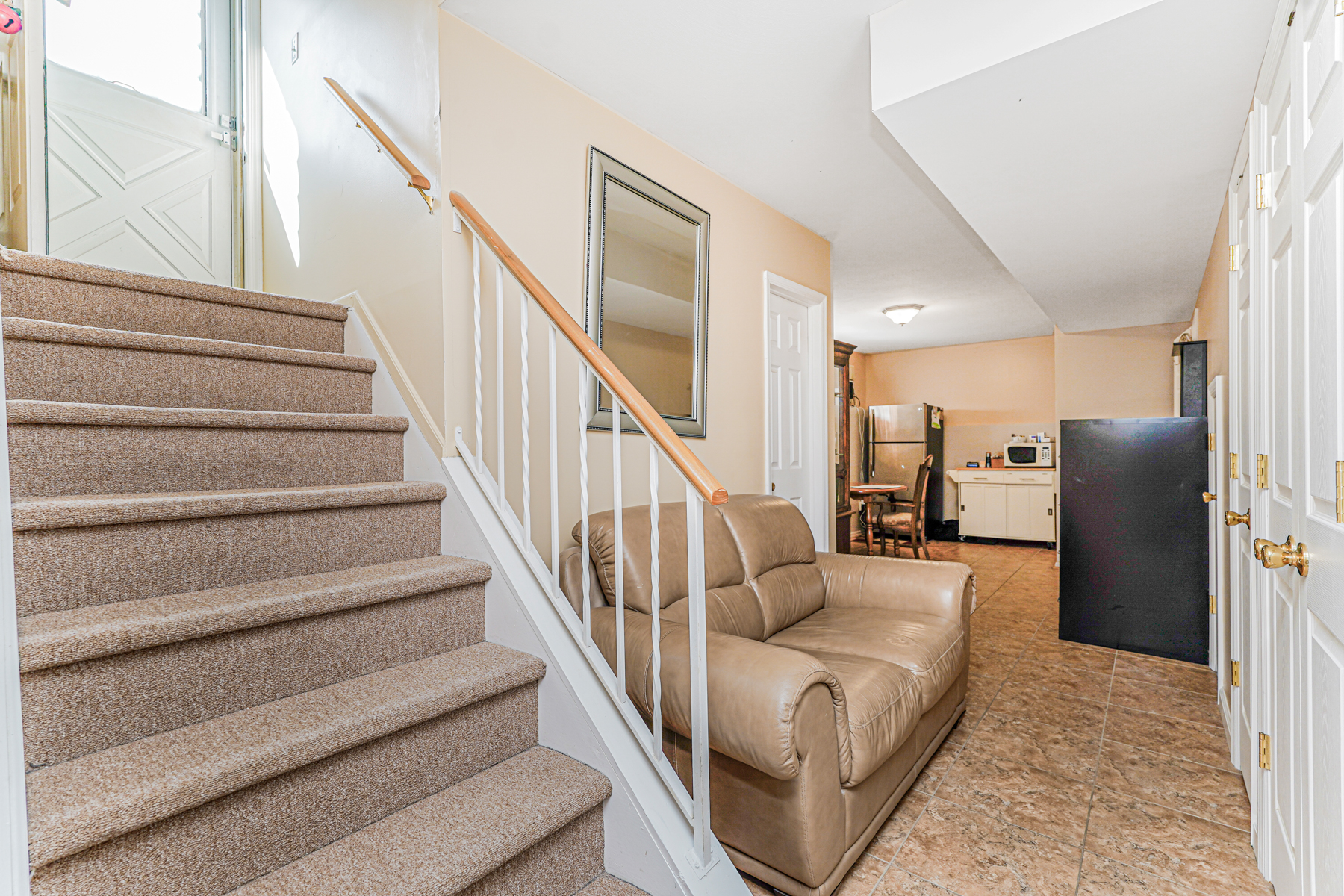 287 Greaves Avenue Staten Island, NY 10308 - Photo 27 of 35 a living room with furniture and a chandelier