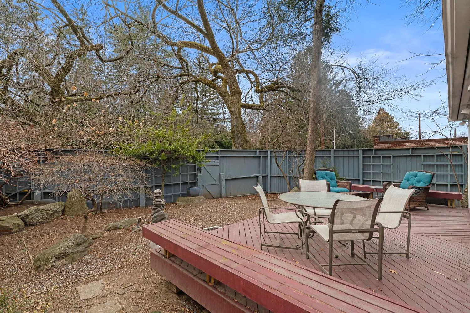 a view of a backyard with sitting area