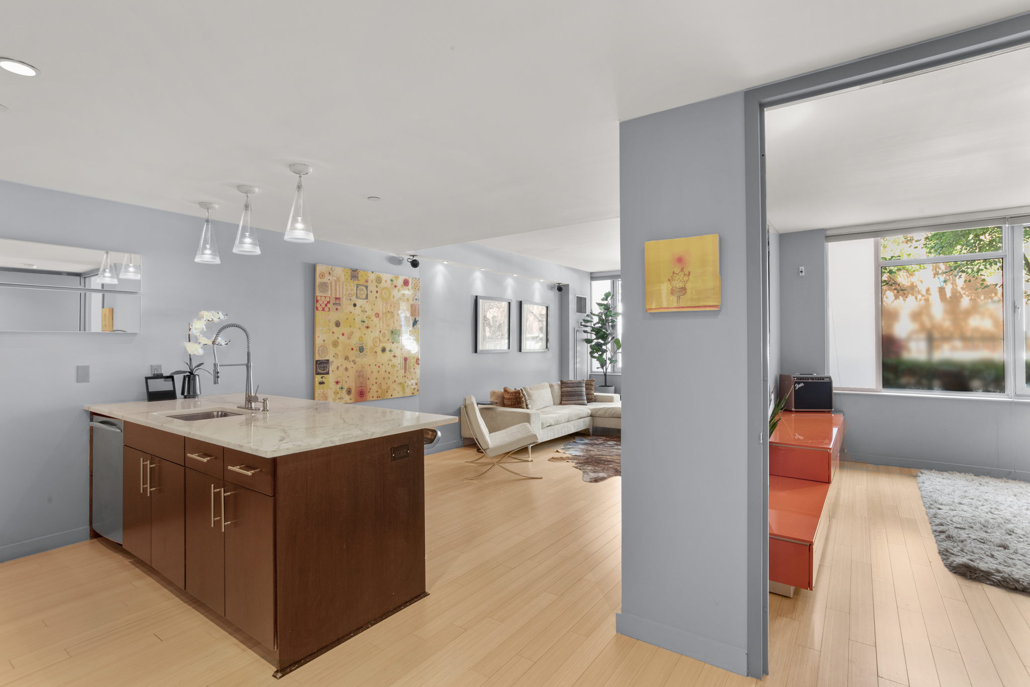 350 West 53rd Street, Unit THG Manhattan, NY 10019 - Photo 5 of 25 a view of living room with granite countertop furniture and fireplace