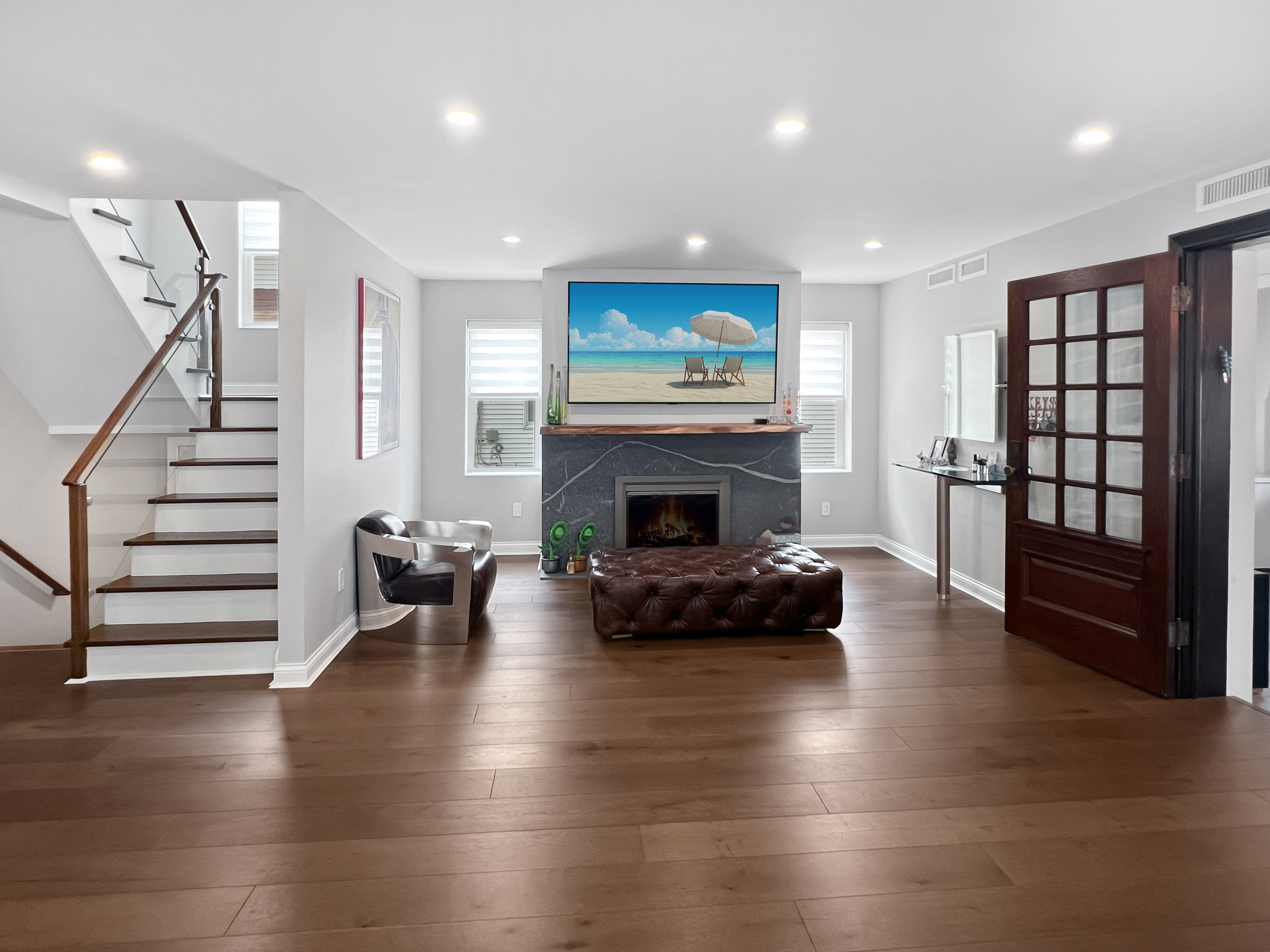 5021 Surf Avenue Brooklyn, NY 11224 - Photo 2 of 32 a living room with furniture and a fireplace
