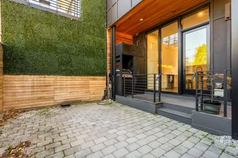 a view of a garden with an outdoor seating
