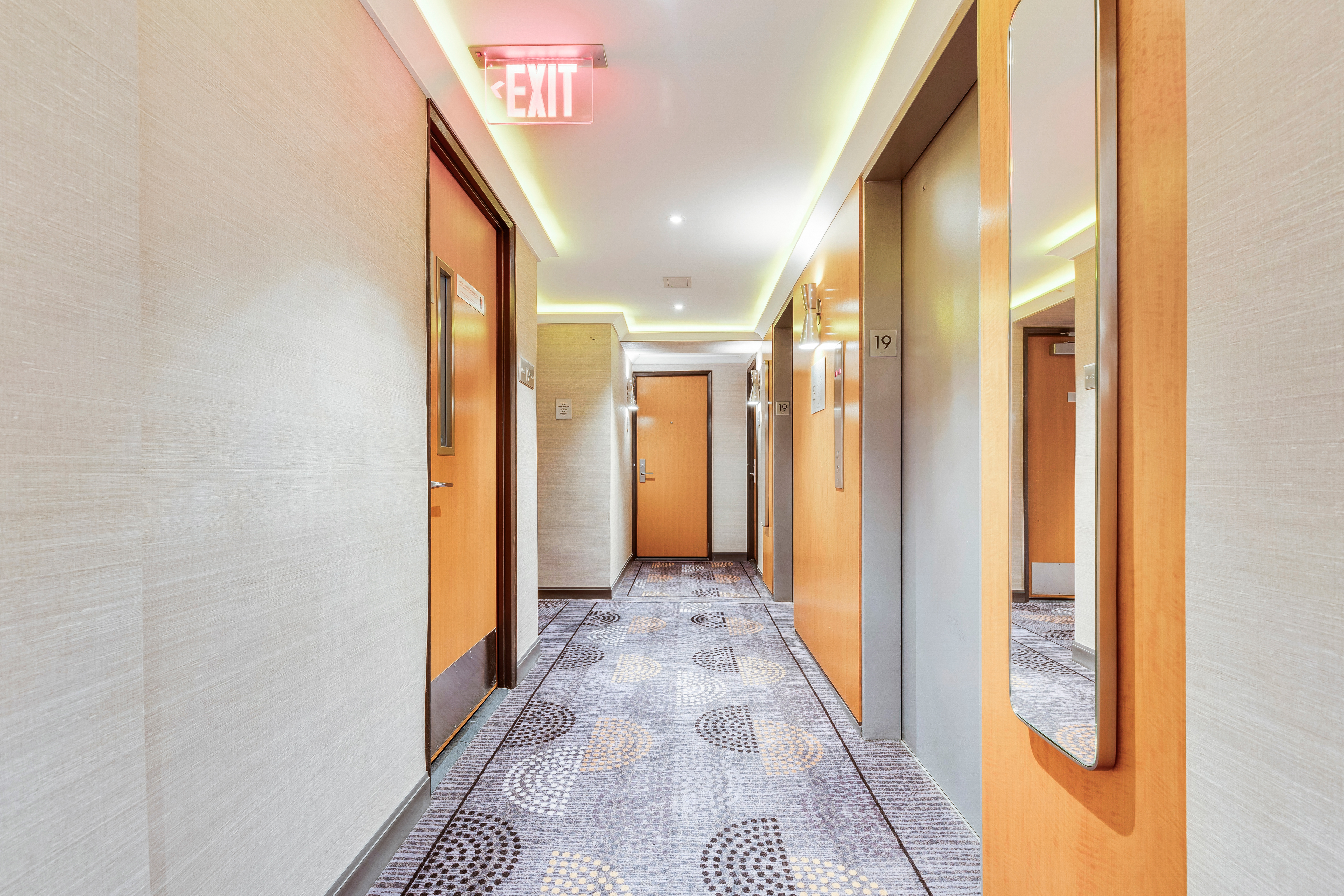 200 Central Park South, Unit 19K Manhattan, NY 10019 - Photo 10 of 14 a view of a hallway with wooden shelves