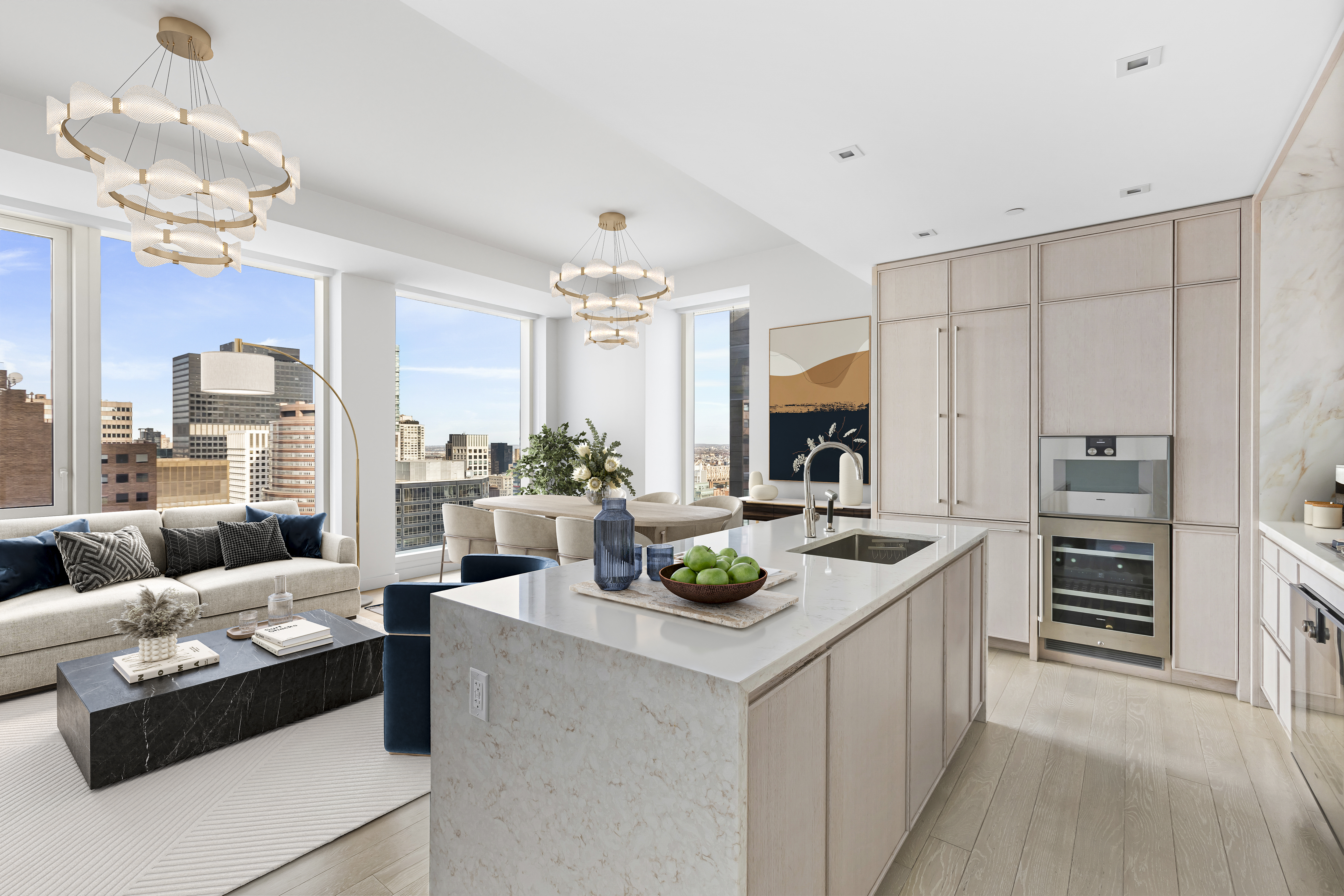 a living room with furniture and a view of kitchen