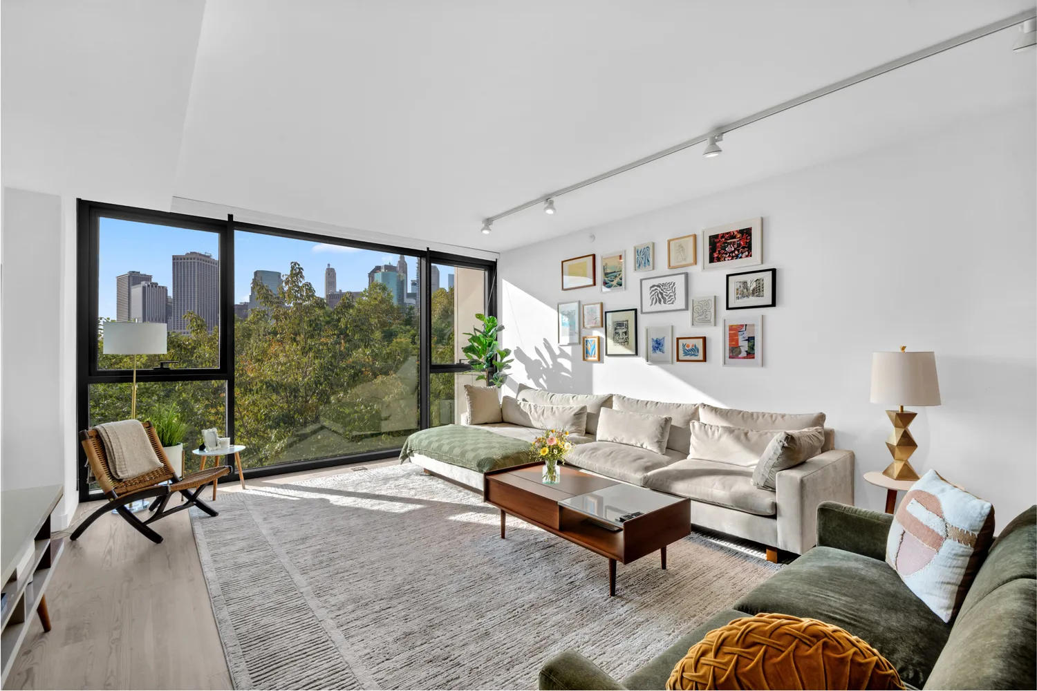 a living room with furniture and a floor to ceiling window