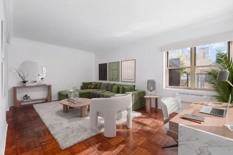 a living room with furniture and a table