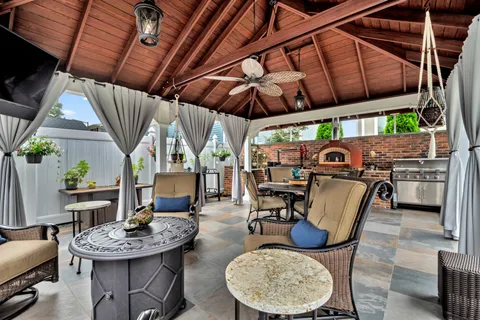 a view of a chair and table on the deck