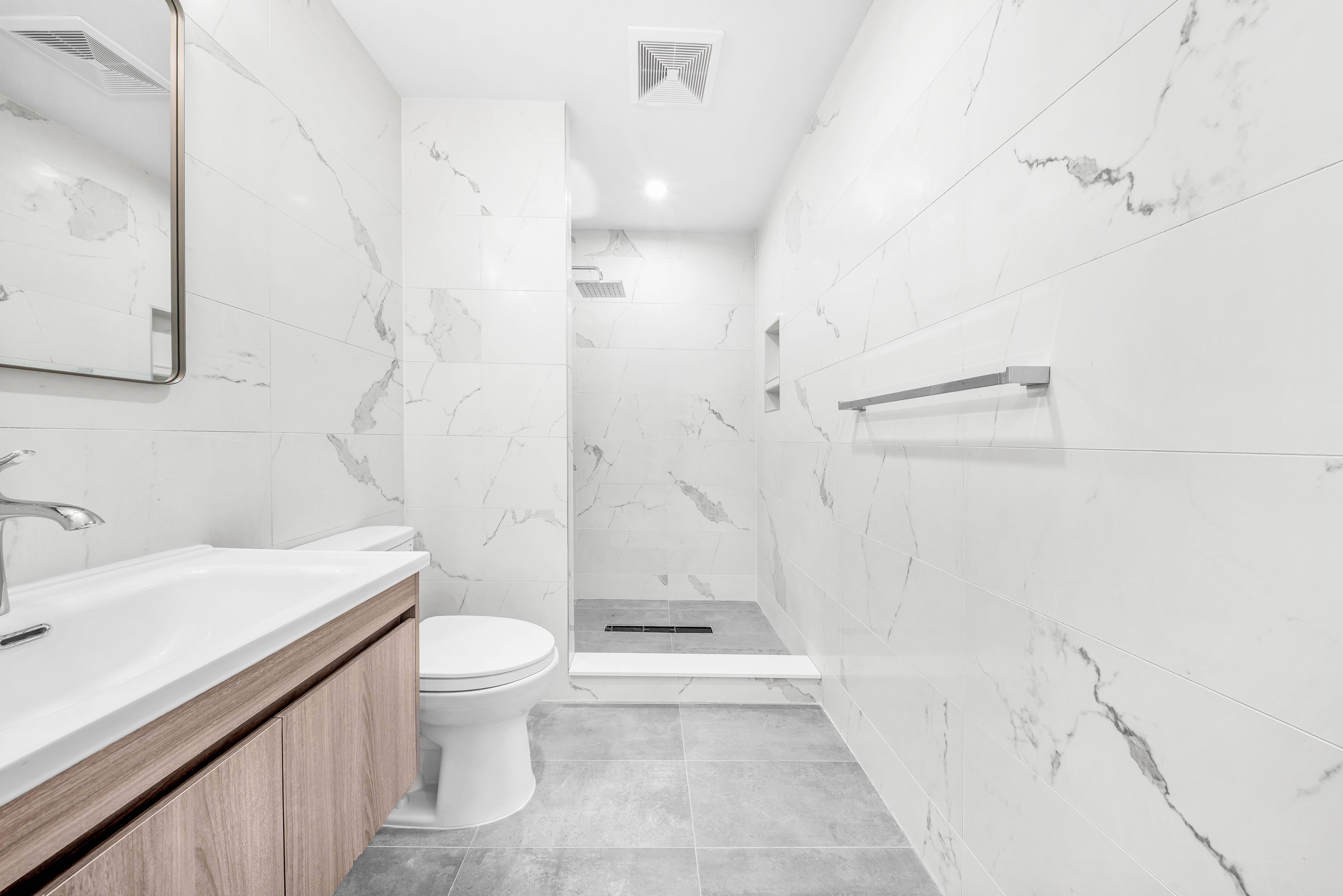 30-24 32nd Street, Unit 4A Queens, NY 11102 - Photo 11 of 22 a bathroom with a sink a toilet and shower