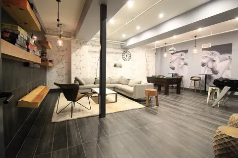 a living room with furniture and wooden floor