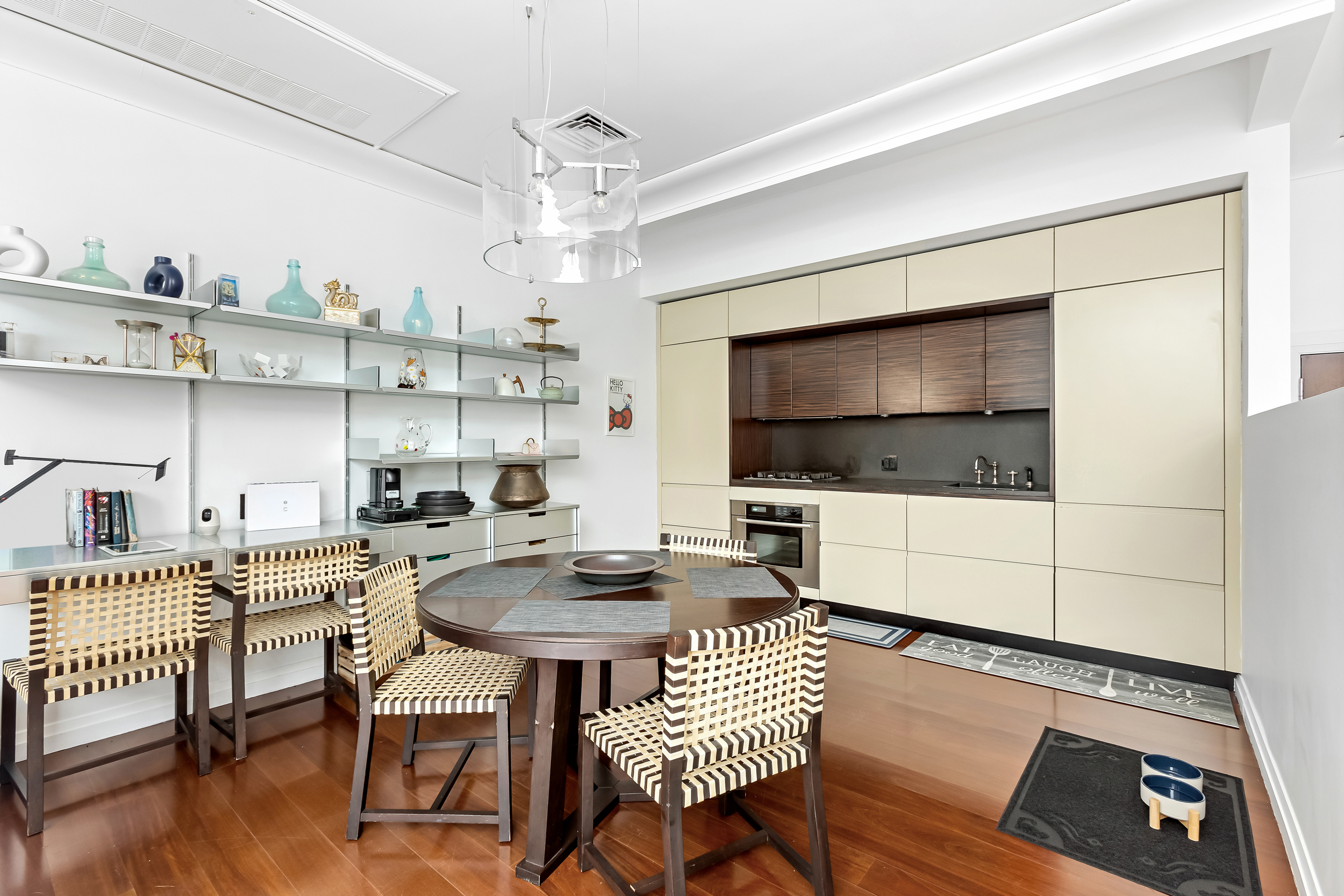 55 Wall Street, Unit PH942 Manhattan, NY 10005 - Photo 4 of 9 a living room with furniture and a flat screen tv