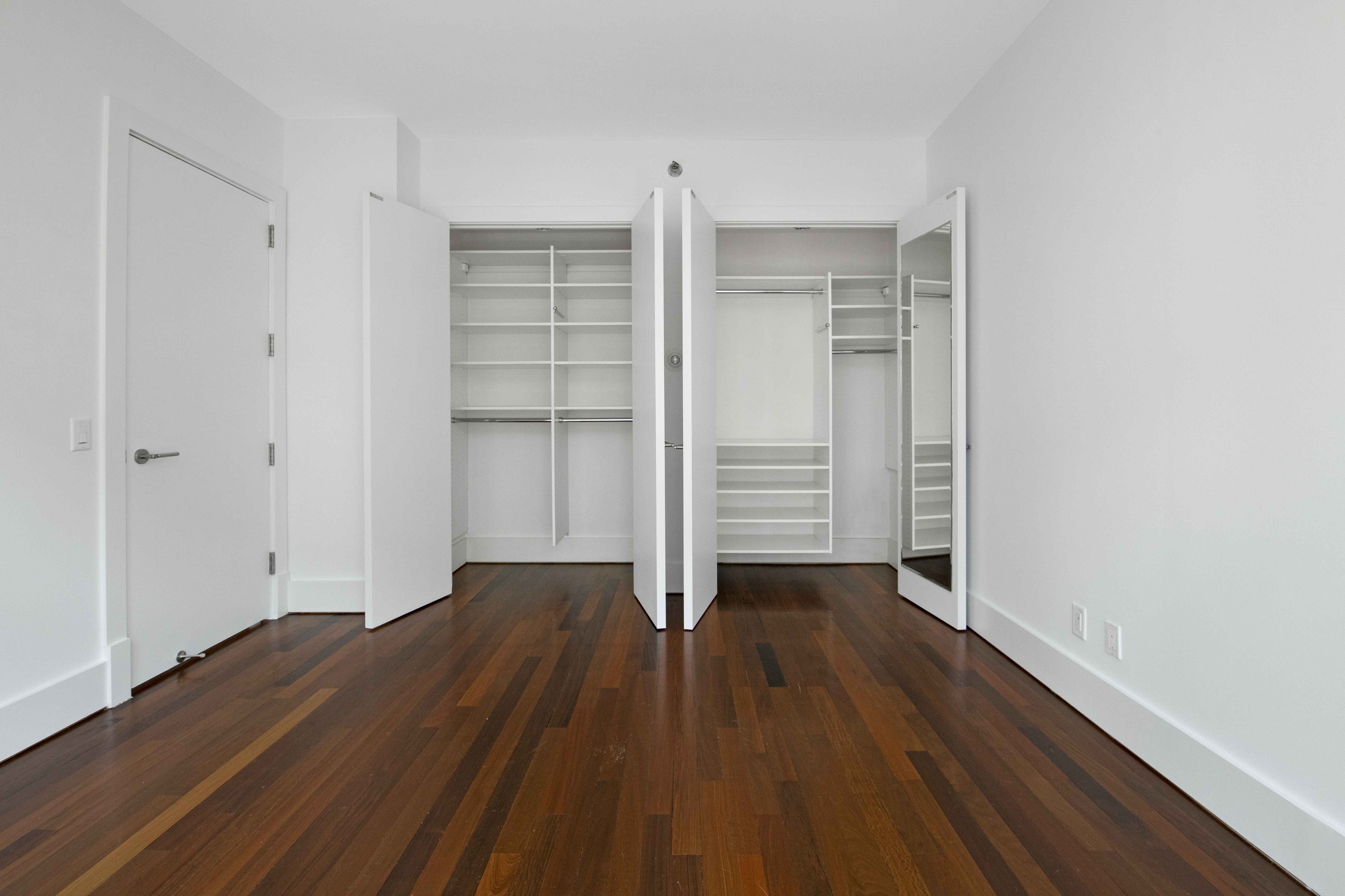 165 West 18th Street, Unit 8B Manhattan, NY 10011 - Photo 7 of 9 wooden floor in an empty room
