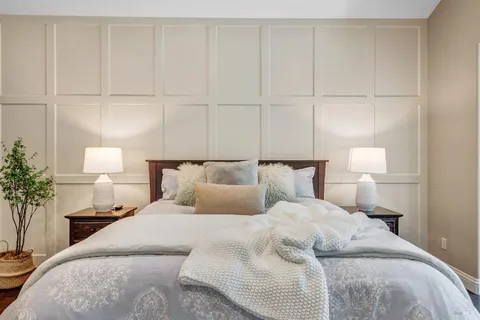 a bedroom with a bed and a dresser