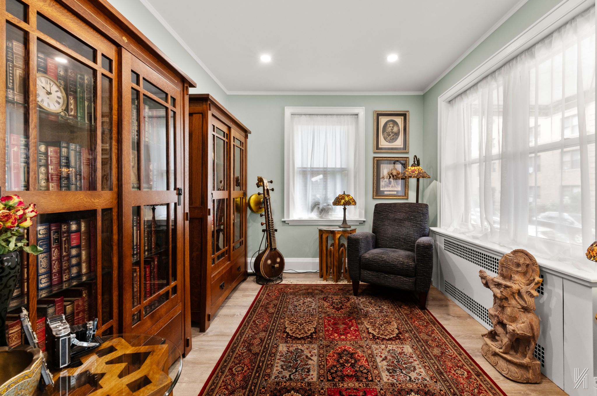 34-41 85th Street, Unit 1X Queens, NY 11372 - Photo 7 of 24 a living room with furniture a large window and a rug