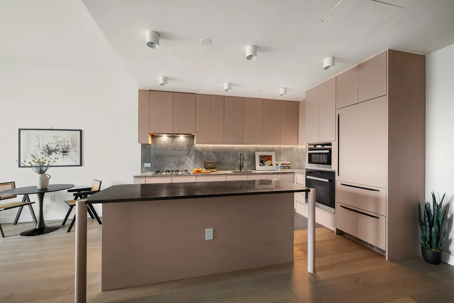 a kitchen with appliances cabinets and furniture