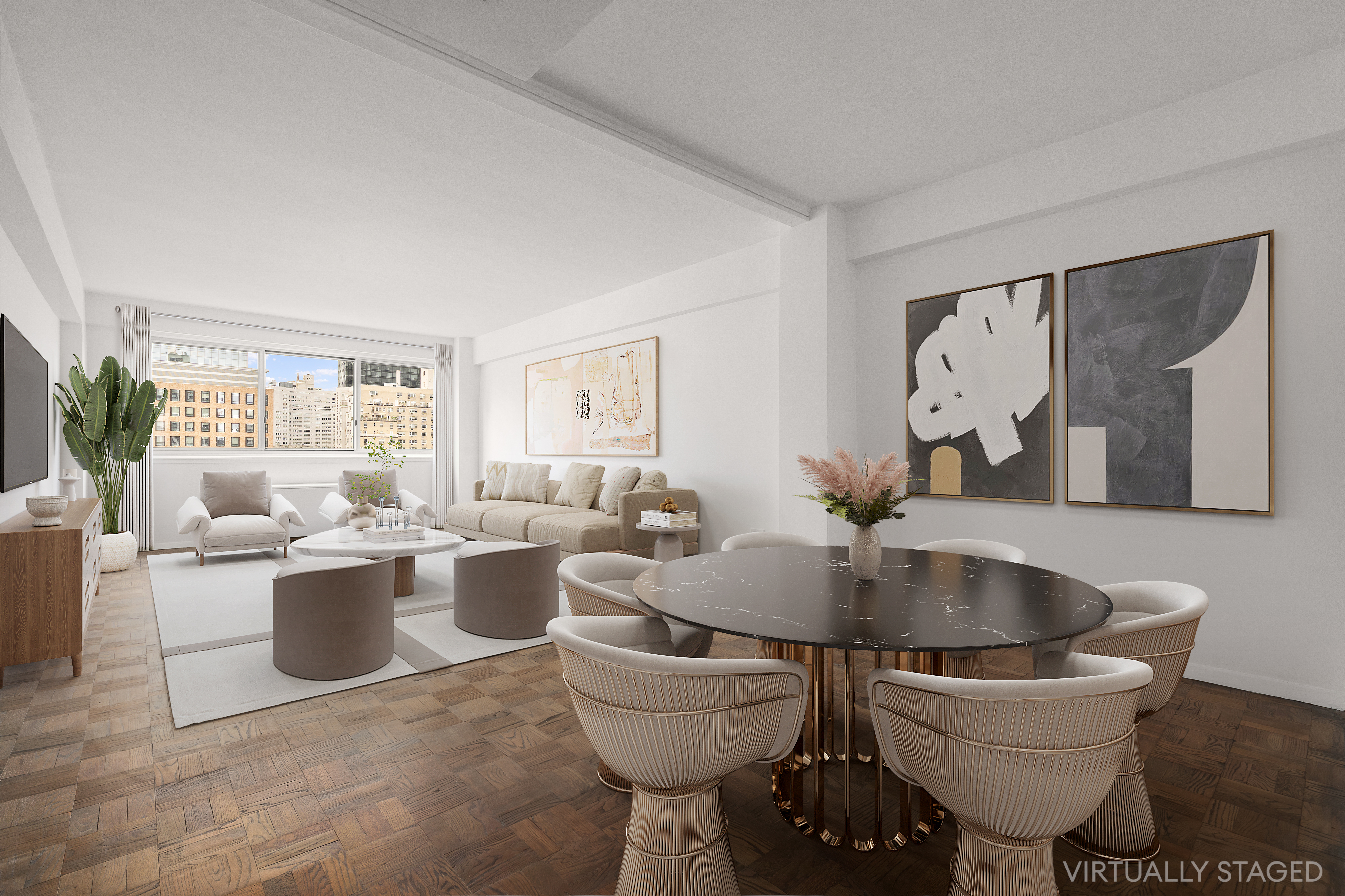 a living room with couches and painting on the wall