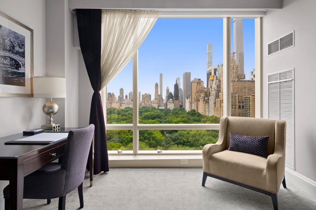 1 Central Park West, Unit 1506 Manhattan, NY 10023 - Photo 3 of 16 a view of a livingroom with furniture and a large window