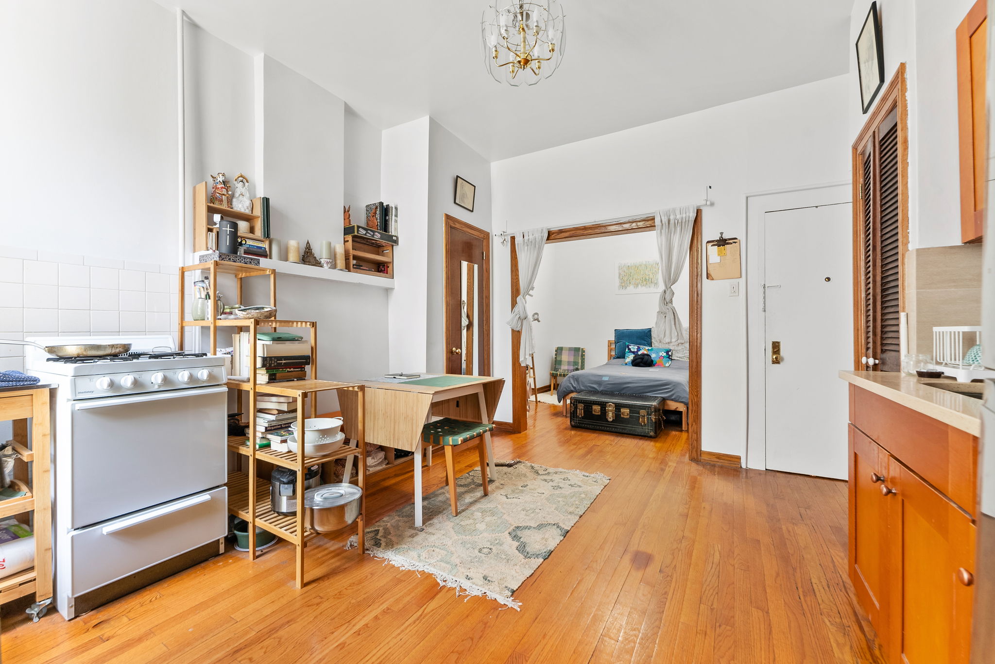 318 11th Street, Unit 1R Brooklyn, NY 11215 - Photo 3 of 7 a living room with furniture and a table