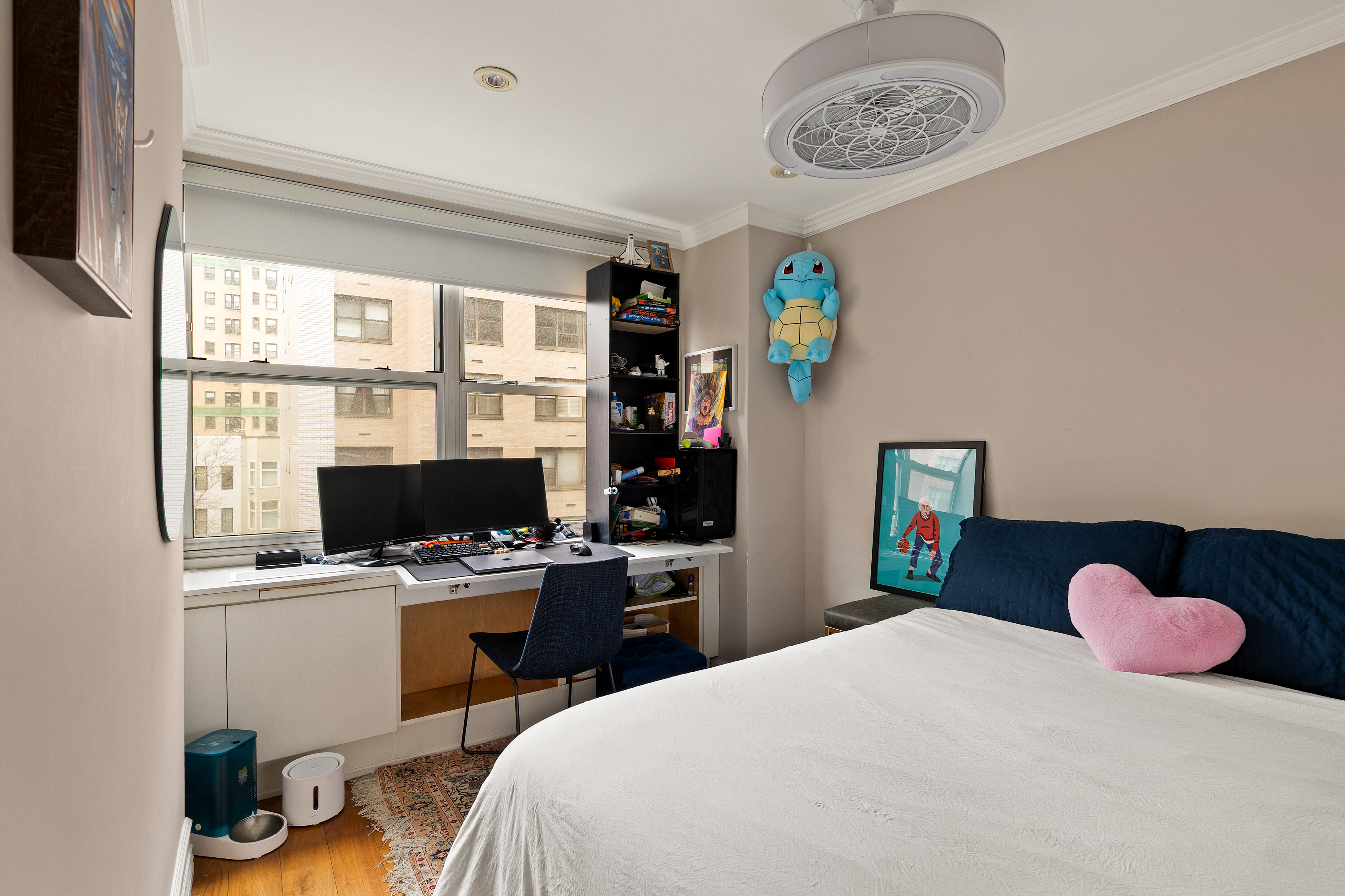 310 East 70th Street, Unit 6A Manhattan, NY 10021 - Photo 5 of 9 a bedroom with a bed and a window