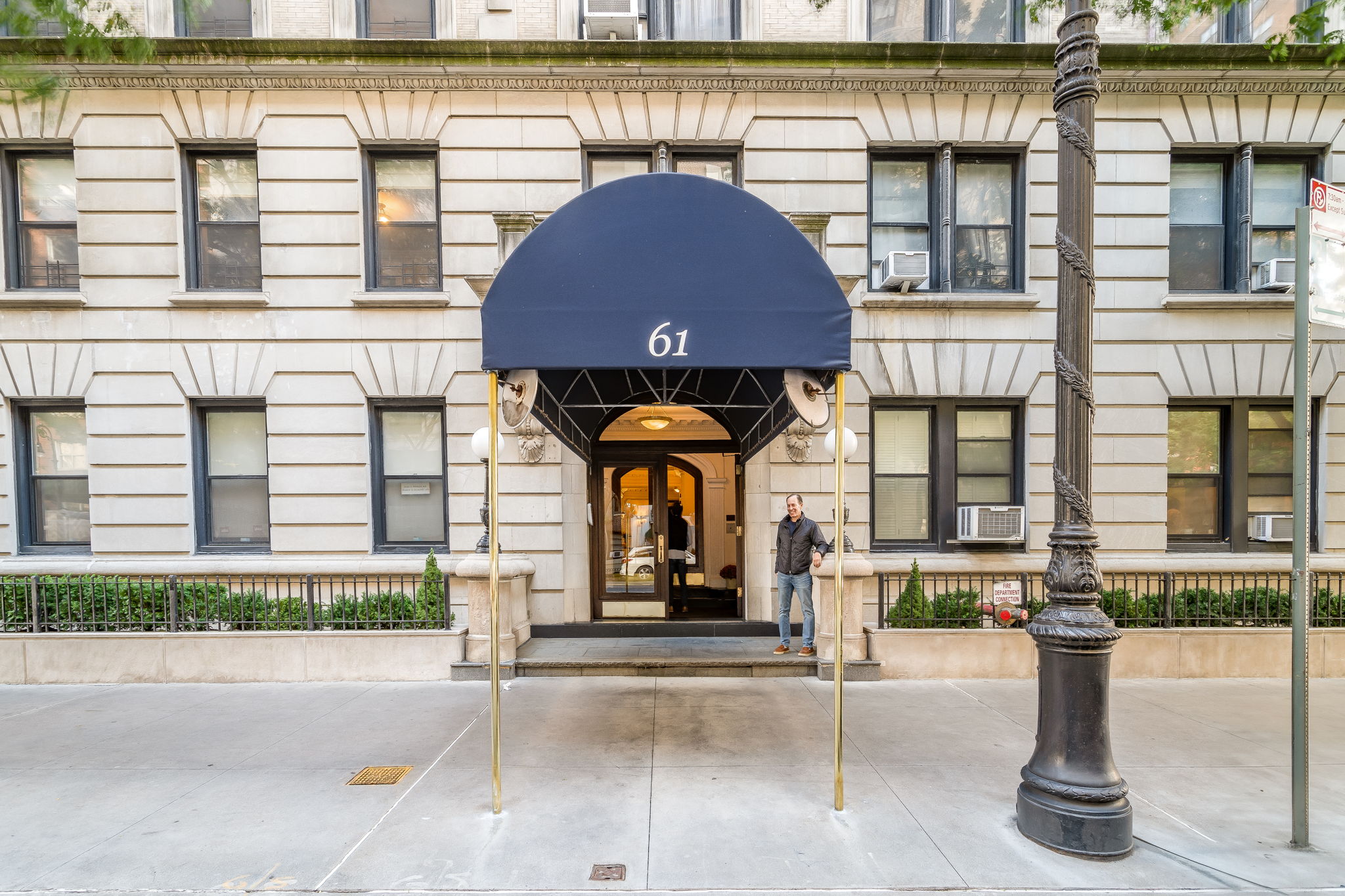 61 East 86th Street, Unit 25 Manhattan, NY 10028 - Photo 7 of 9 a front view of a building with street