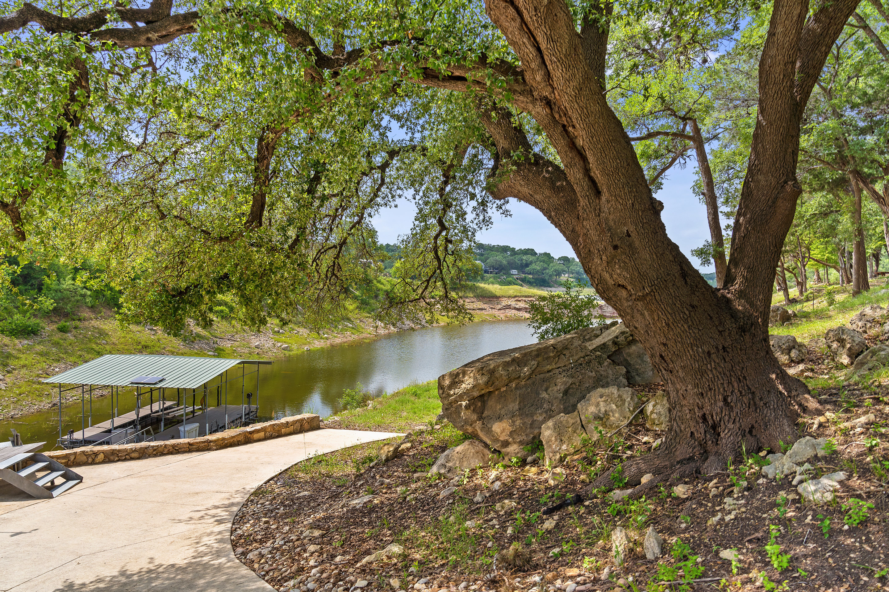 808 Rivercliff Drive Spicewood, TX 78669 - Photo 62 of 71 a view of a tree next to a yard