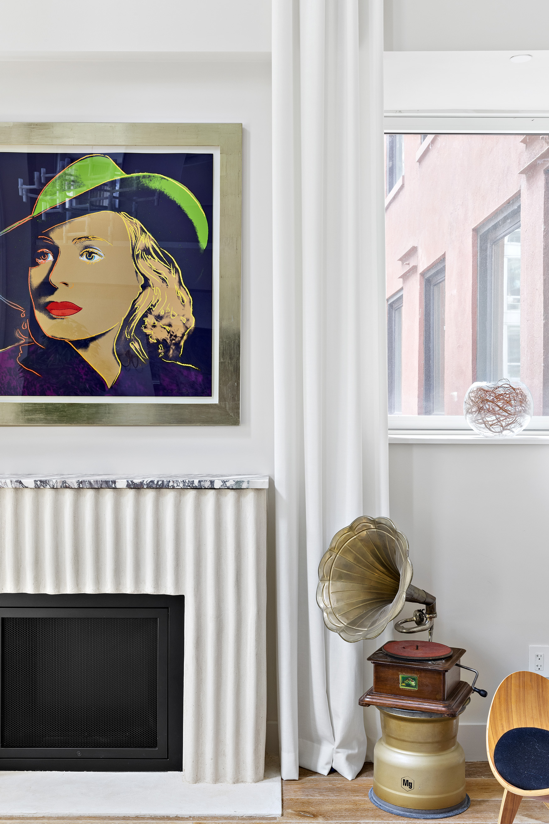 93 Worth Street, Unit 311 Manhattan, NY 10013 - Photo 9 of 17 a living room with a painting on the wall and a window