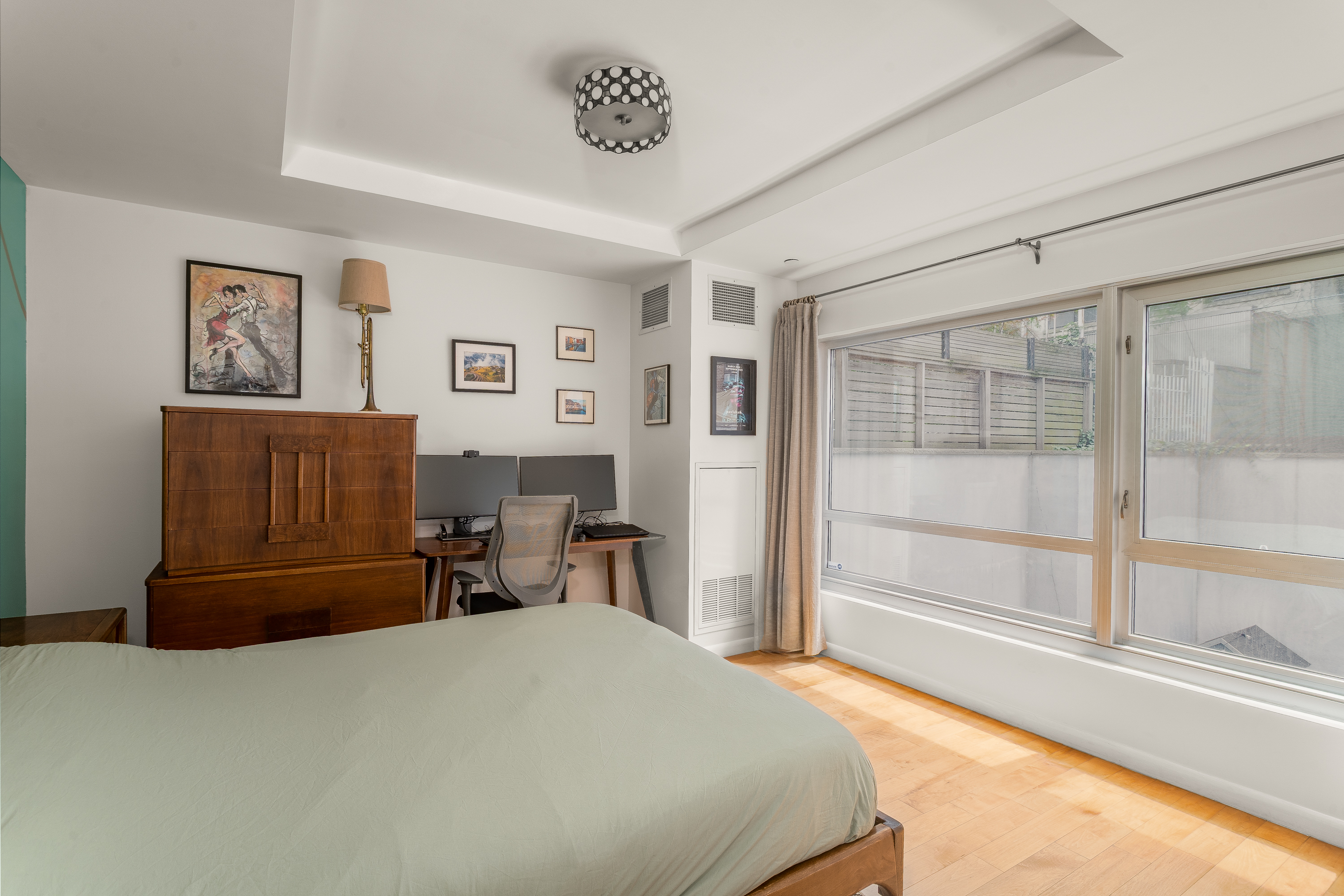 560 Carroll Street, Unit 1D Brooklyn, NY 11215 - Photo 7 of 19 a bedroom with a bed and glass window