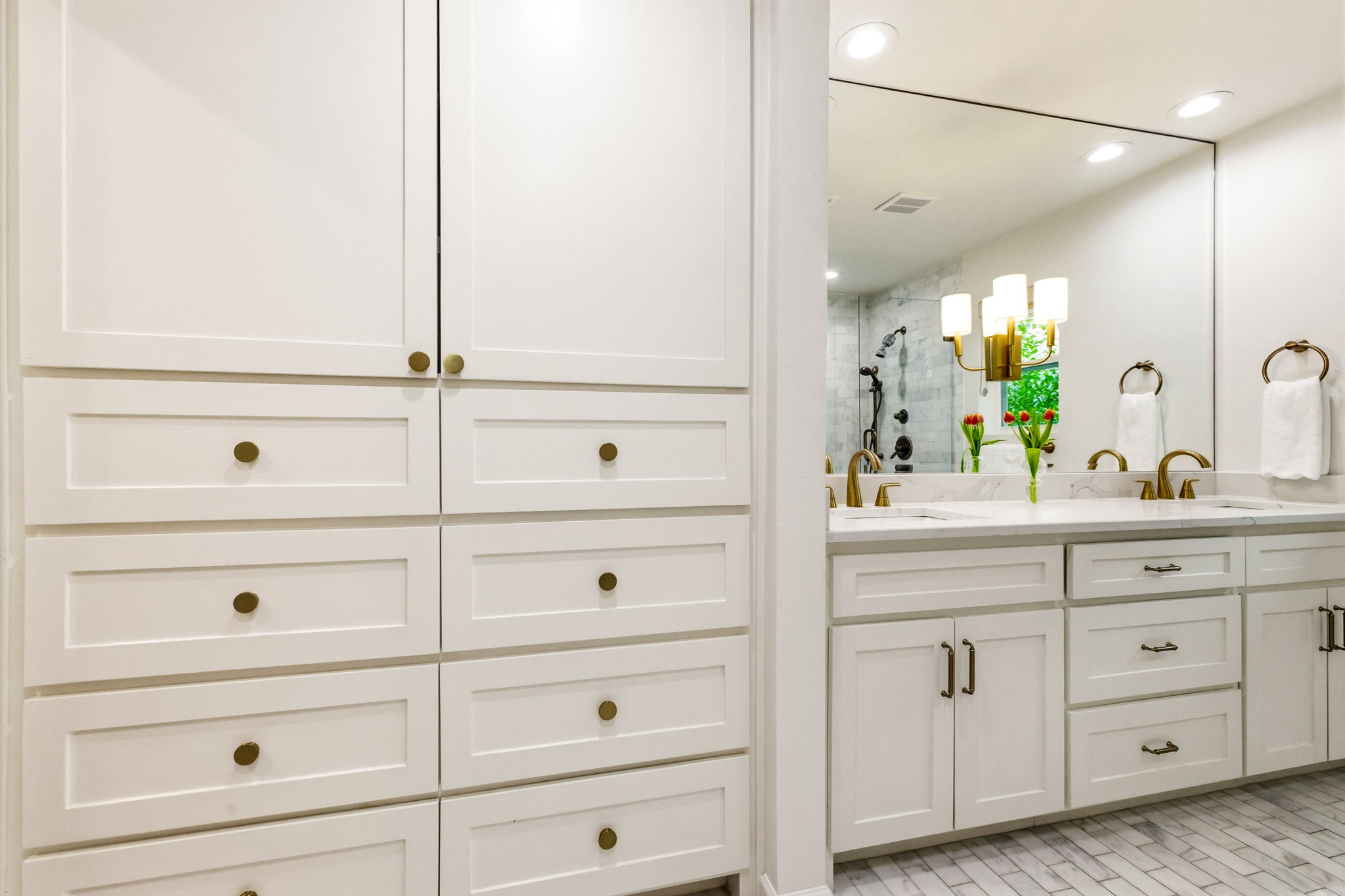 5765 Stonegate Road Dallas, TX 75209 - Photo 22 of 37 a bathroom with a sink vanity and mirror