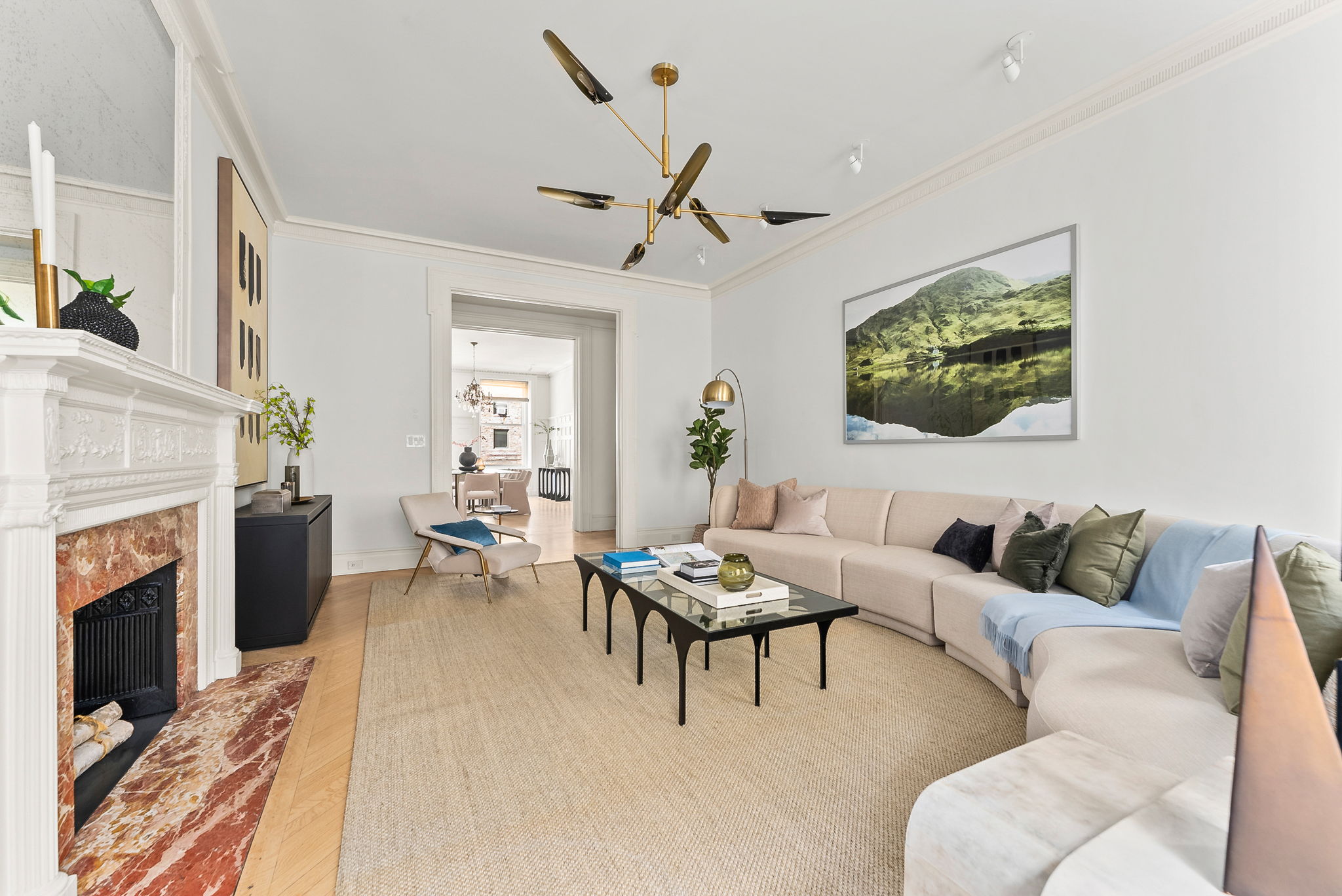 390 West End Avenue, Unit 4J Manhattan, NY 10024 - Photo 3 of 17 a living room with furniture a fireplace and a flat screen tv